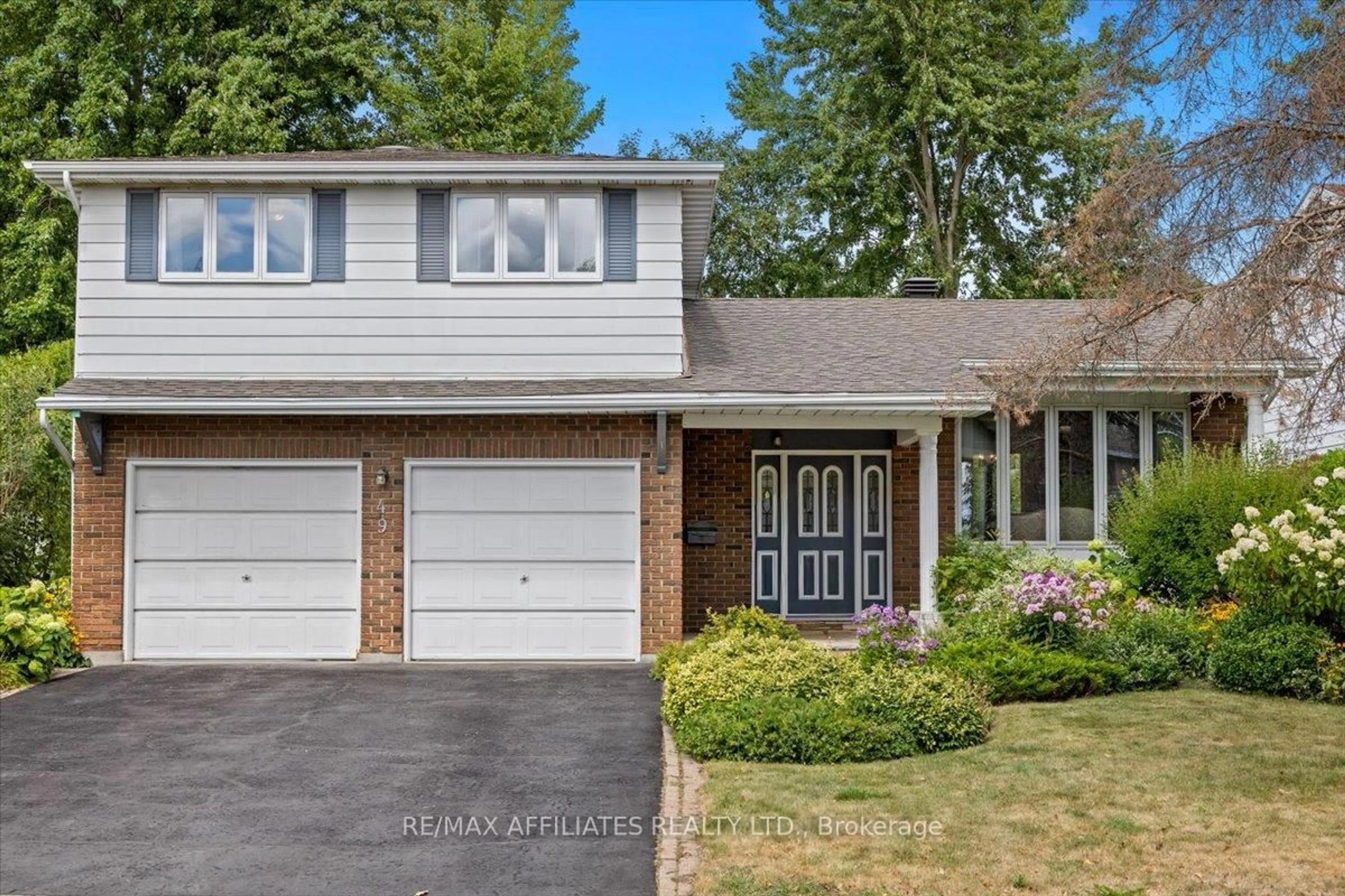 Home with vinyl exterior material, street for 49 Silver Aspen Cres, Ottawa Ontario K1B 3C3