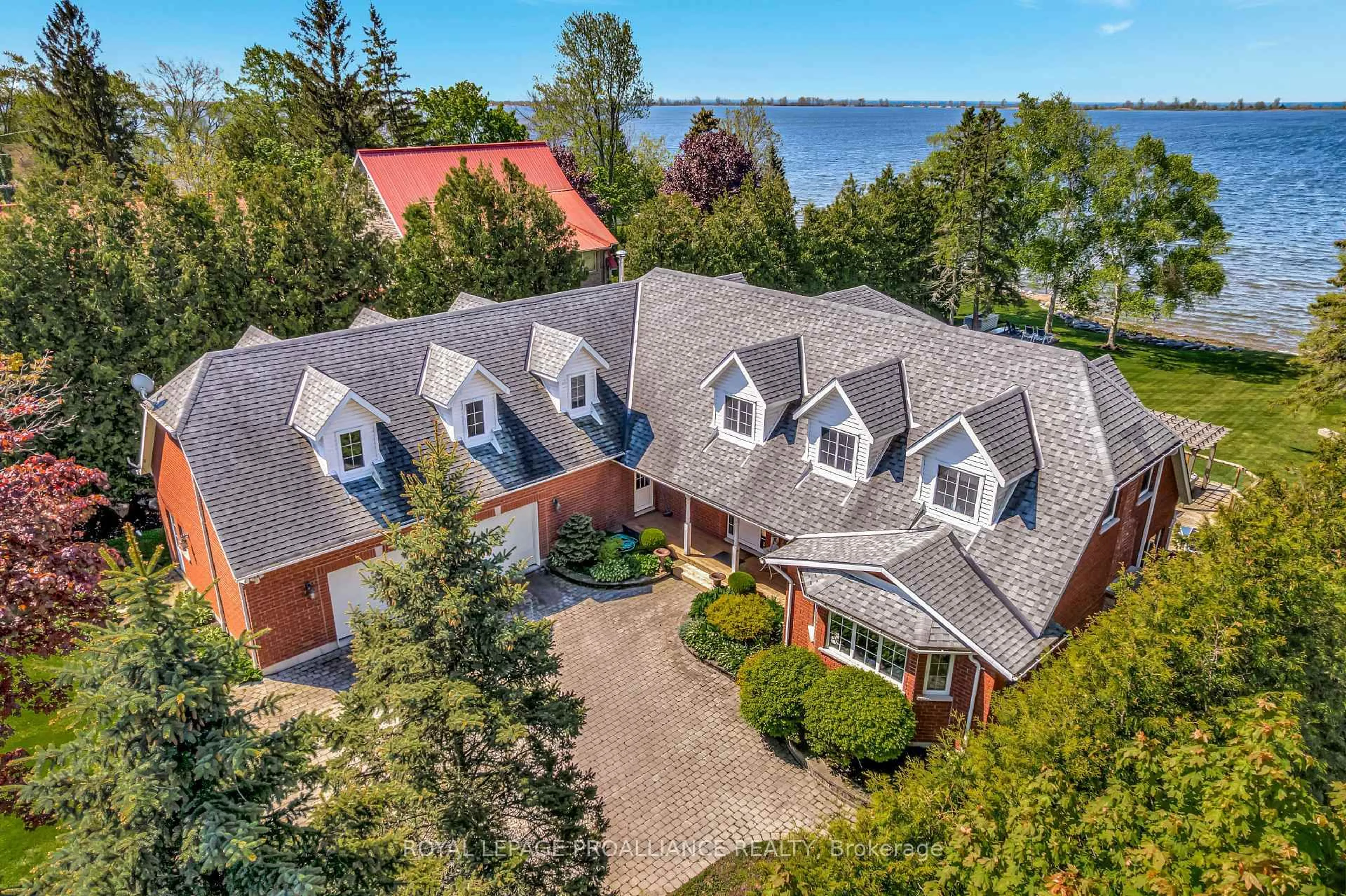A pic from outside/outdoor area/front of a property/back of a property/a pic from drone, water/lake/river/ocean view for 23 Quigg Lane, Prince Edward County Ontario K0K 1L0