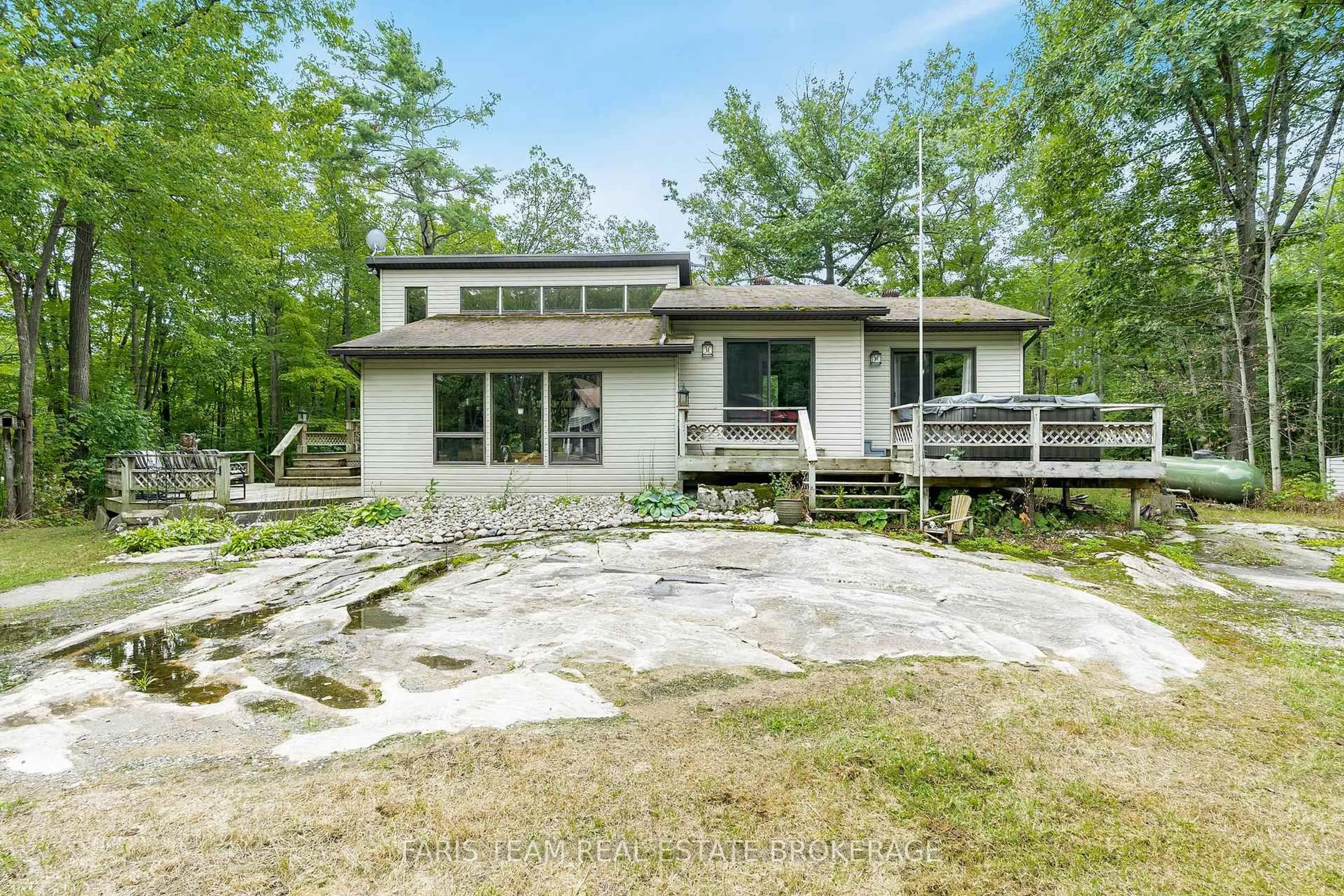 A pic from outside/outdoor area/front of a property/back of a property/a pic from drone, water/lake/river/ocean view for 206 Bonneville Rd, Georgian Bay Ontario L0K 1S0