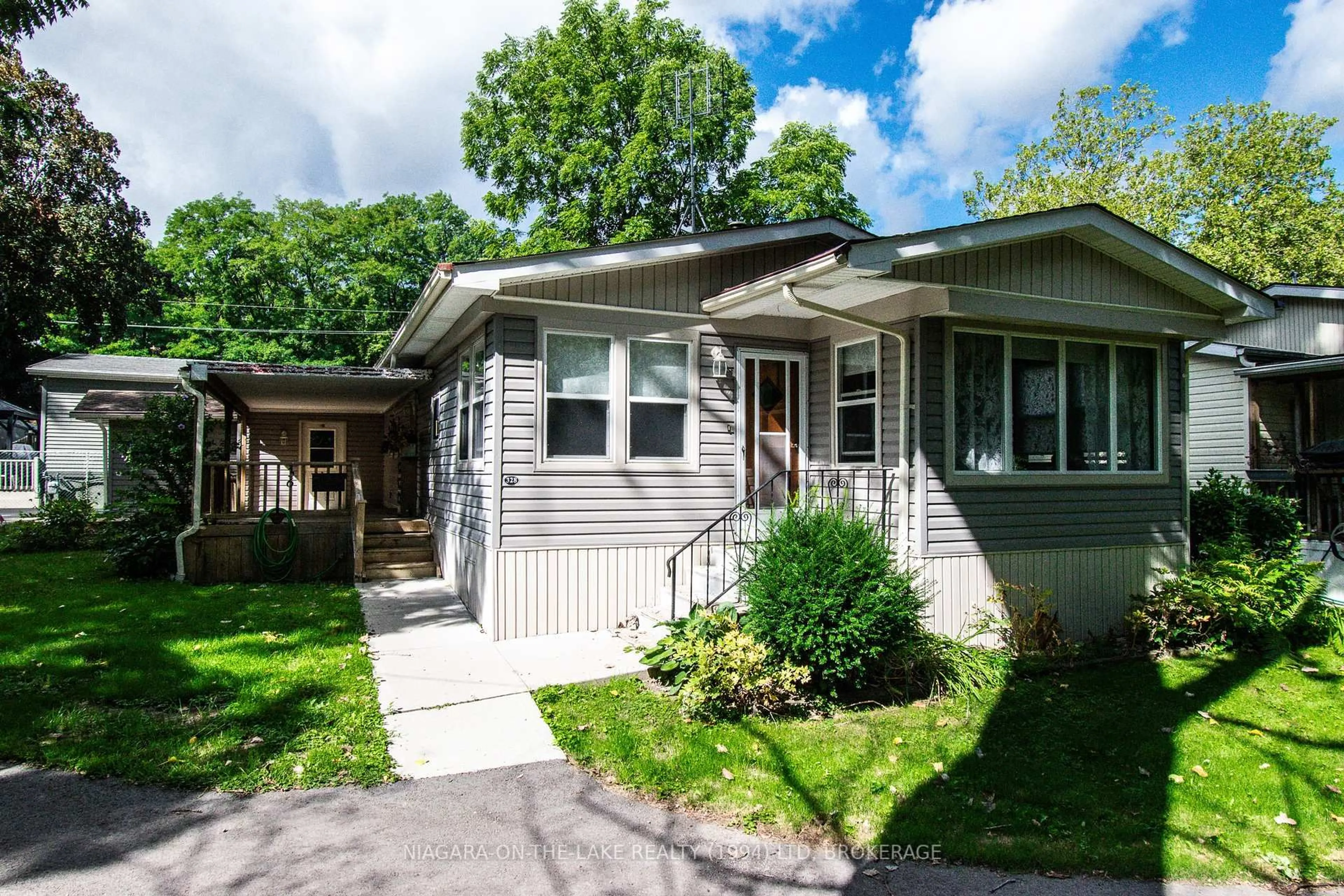 Home with vinyl exterior material, street for 23 Four Mile Creek Rd #328, Niagara-on-the-Lake Ontario L0S 1J1