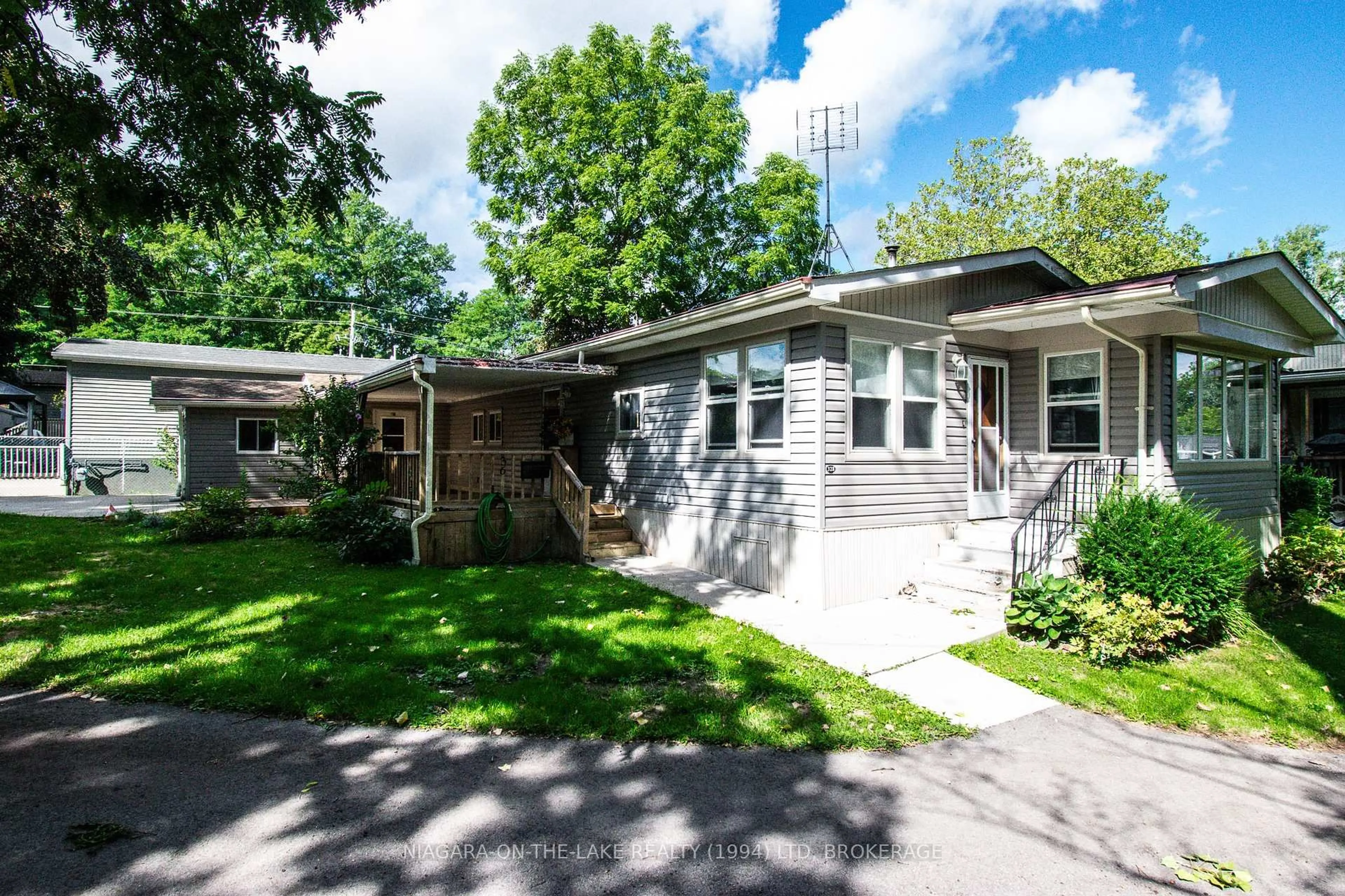 Home with vinyl exterior material, street for 23 Four Mile Creek Rd #328, Niagara-on-the-Lake Ontario L0S 1J1