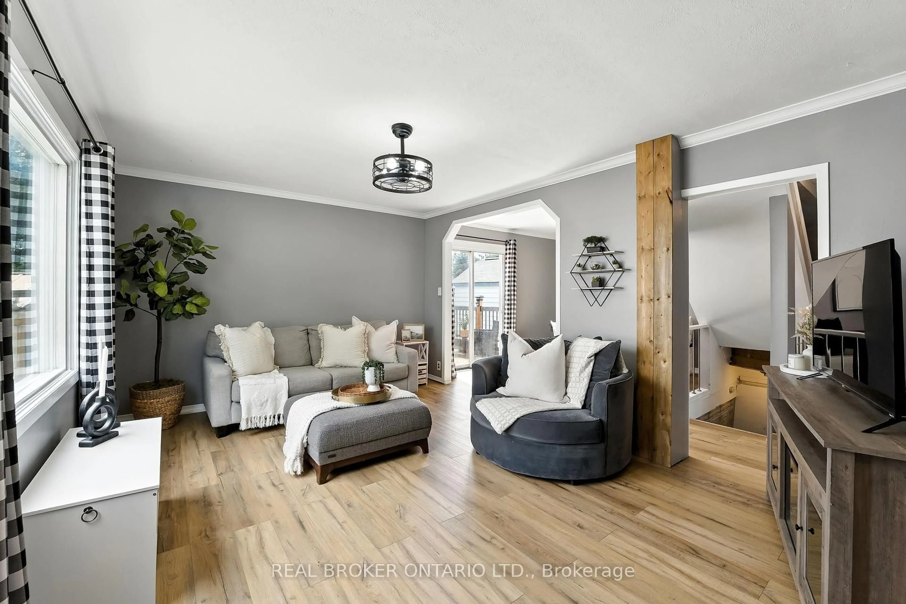 Living room with furniture, wood/laminate floor for 459 Rose Ave, Peterborough Ontario K9J 4E5