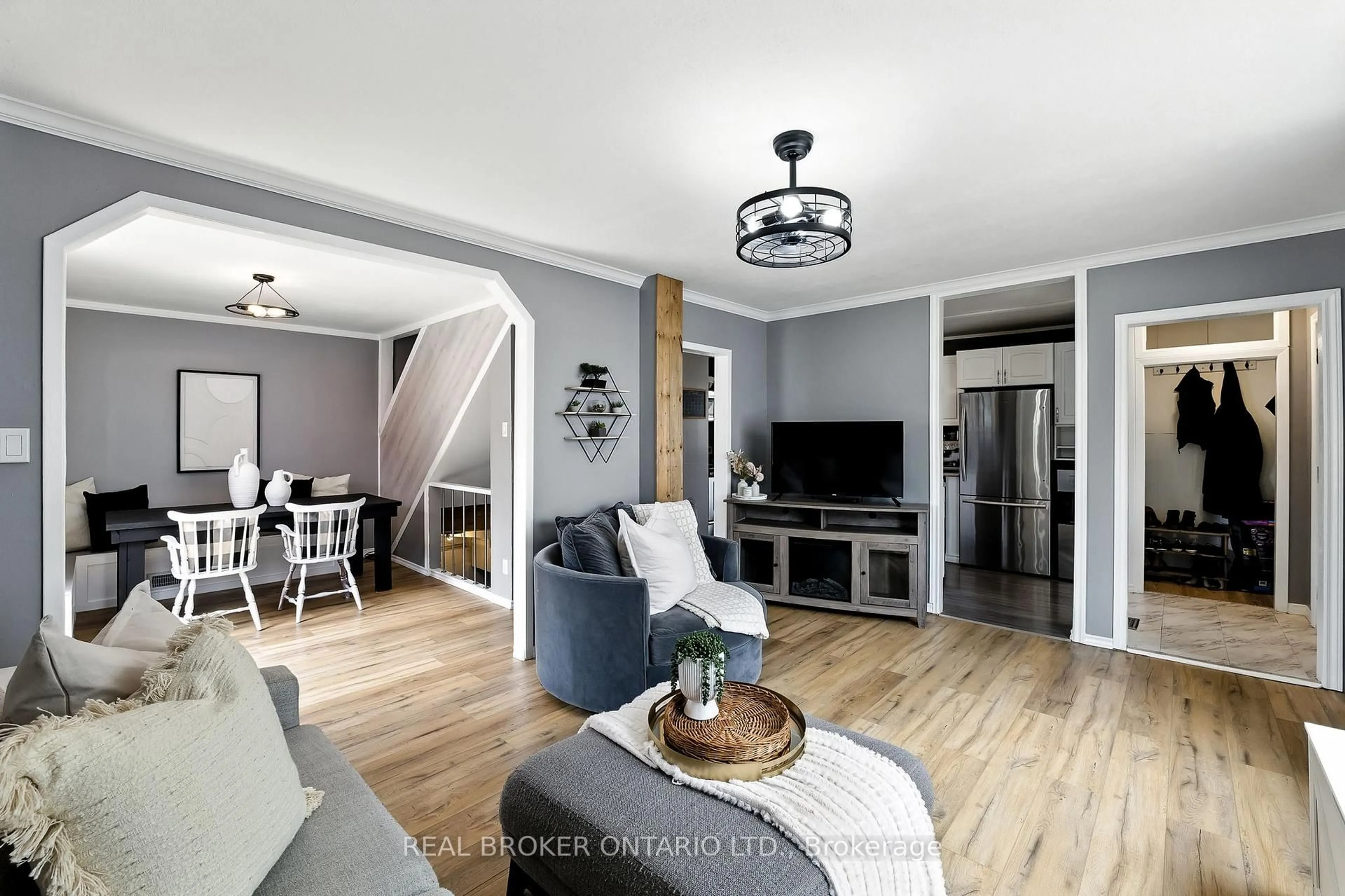 Living room with furniture, wood/laminate floor for 459 Rose Ave, Peterborough Ontario K9J 4E5