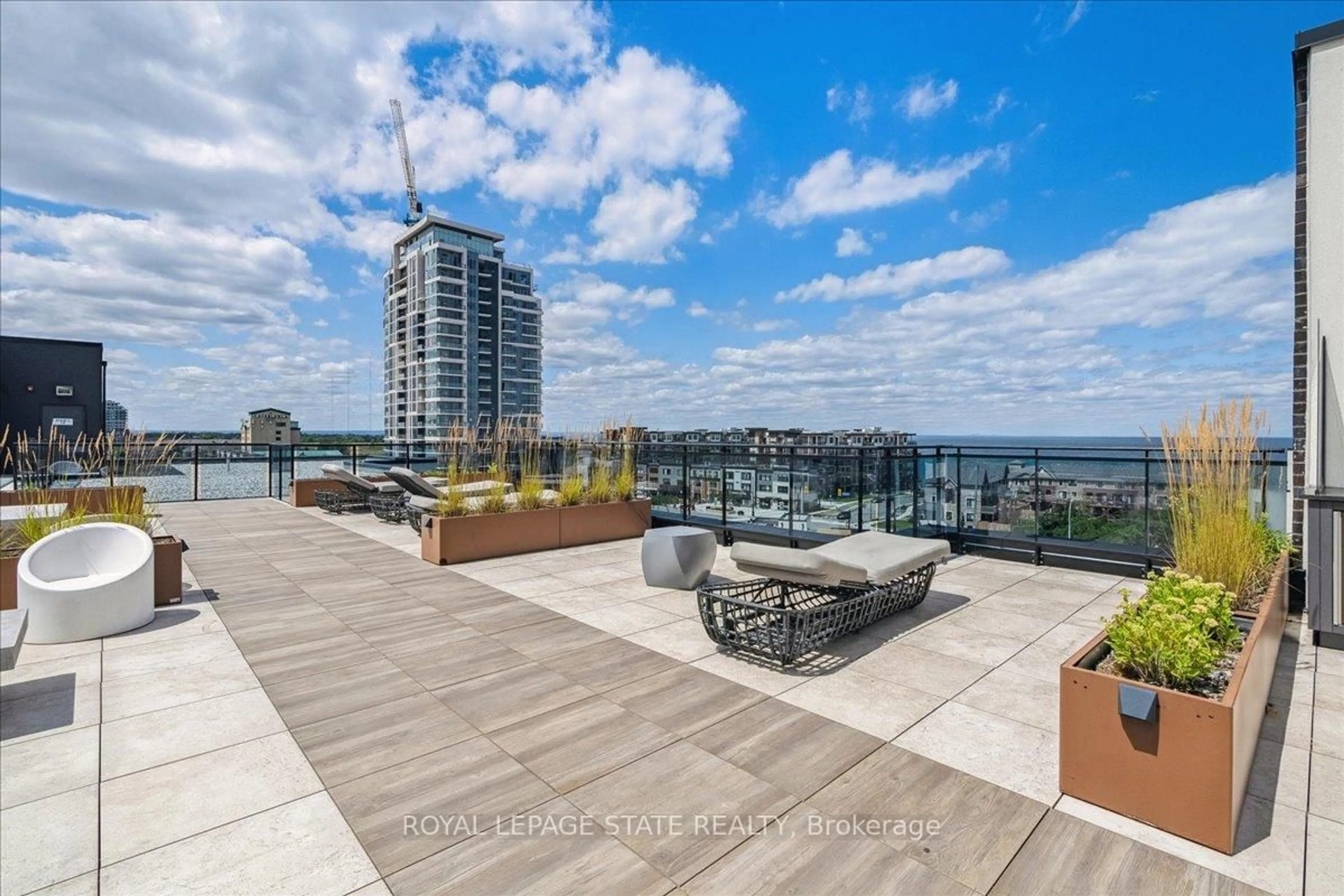 Patio, city buildings view from balcony for 10 Concord Pl #204, Grimsby Ontario L3M 0G6