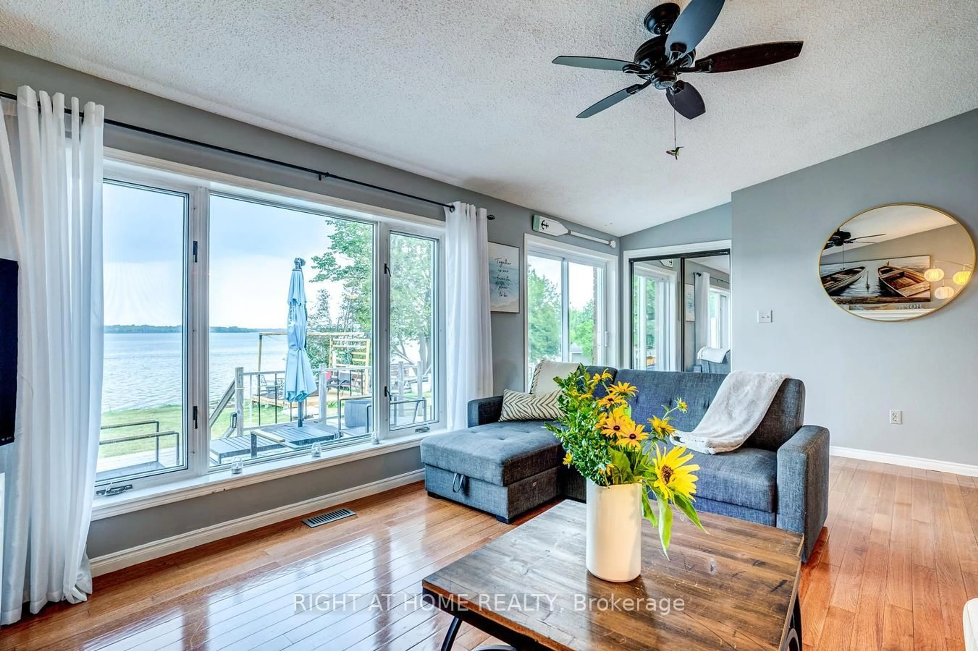 Living room with furniture, wood/laminate floor for 138 Starr Blvd, Kawartha Lakes Ontario K0M 2C0