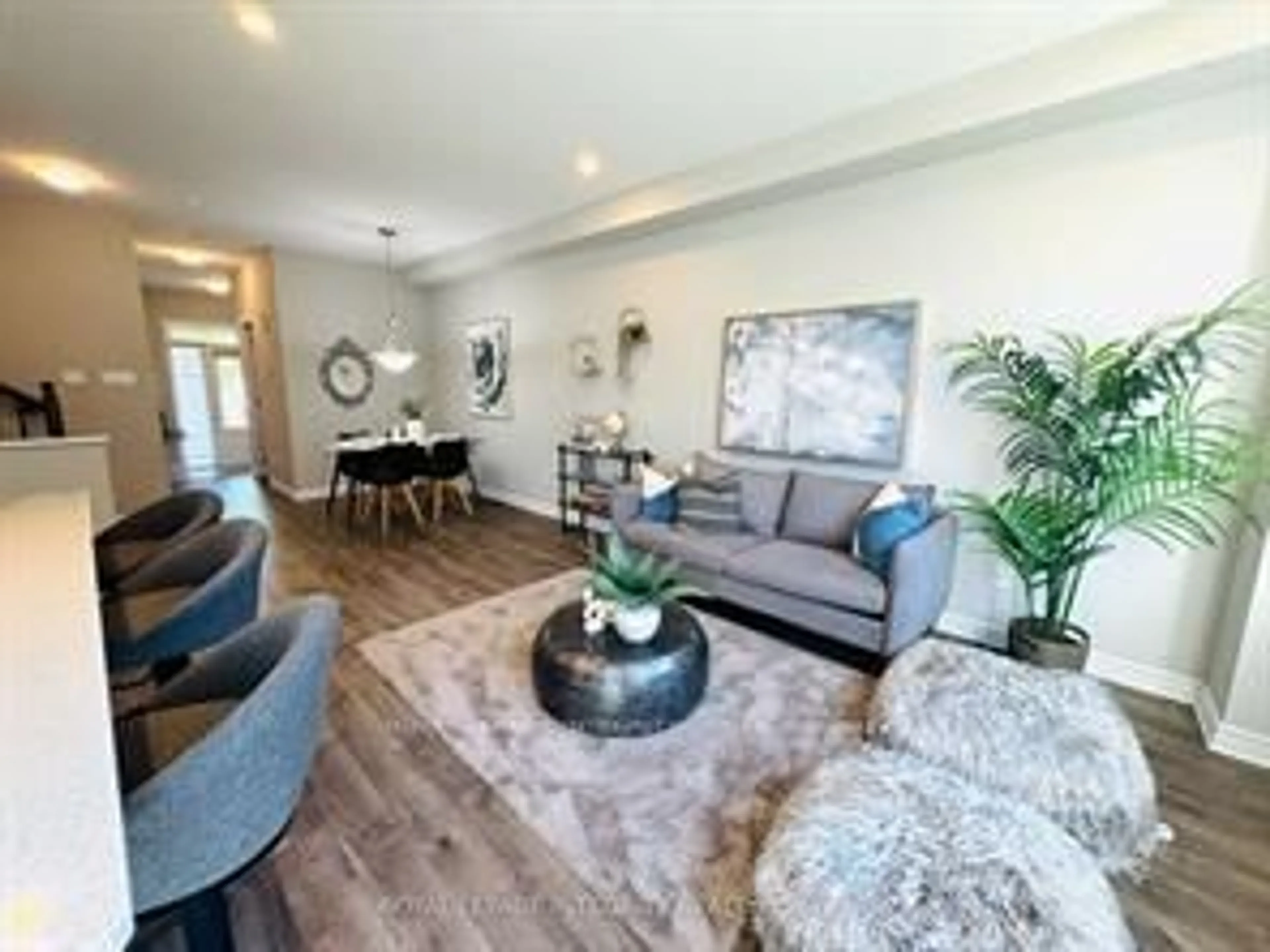 Living room with furniture, wood/laminate floor for 158 Bandelier Way, Stittsville Ontario K2S 2J6