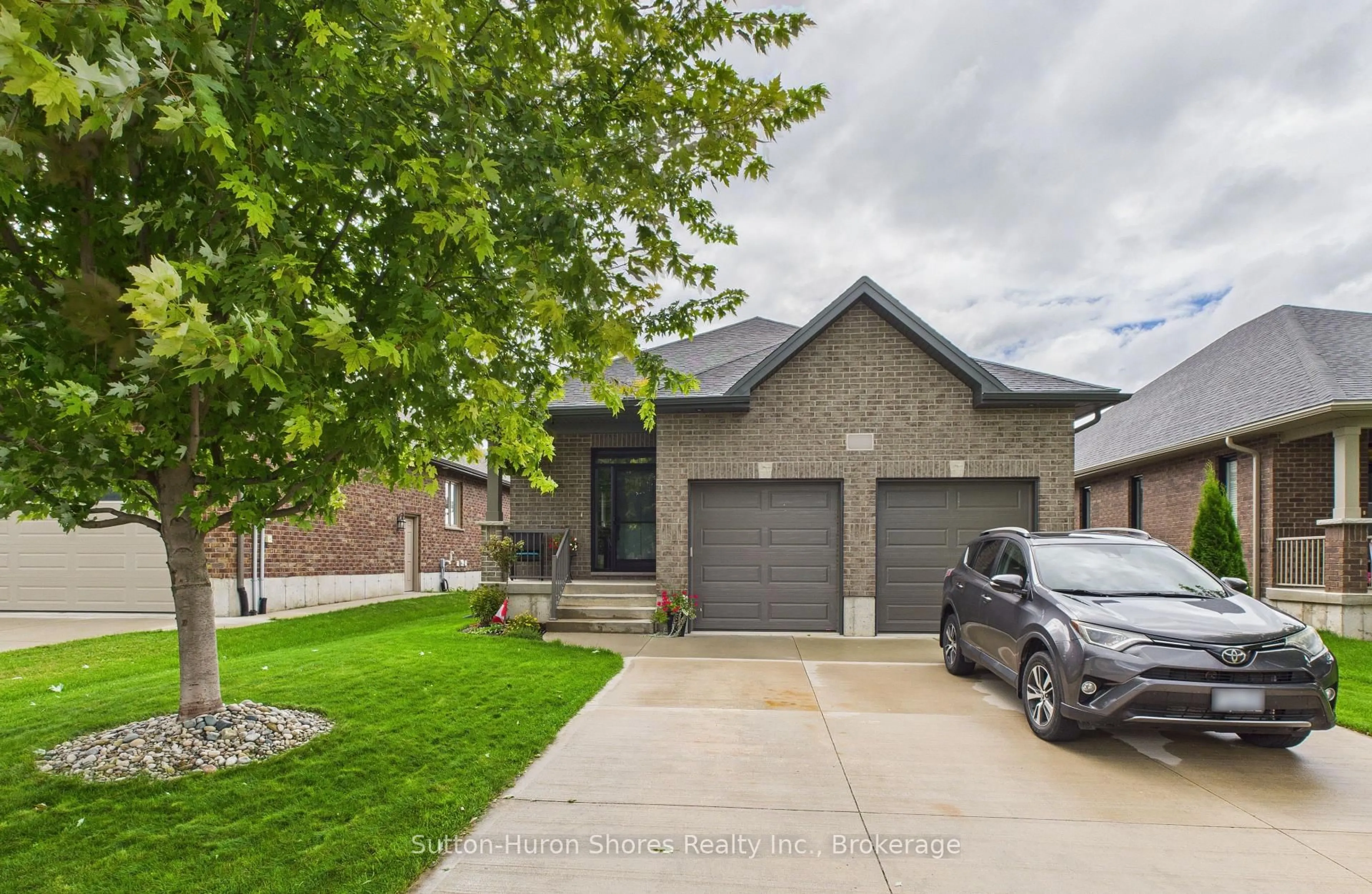 Home with brick exterior material, street for 404 Devonshire Rd, Saugeen Shores Ontario N0H 2C3
