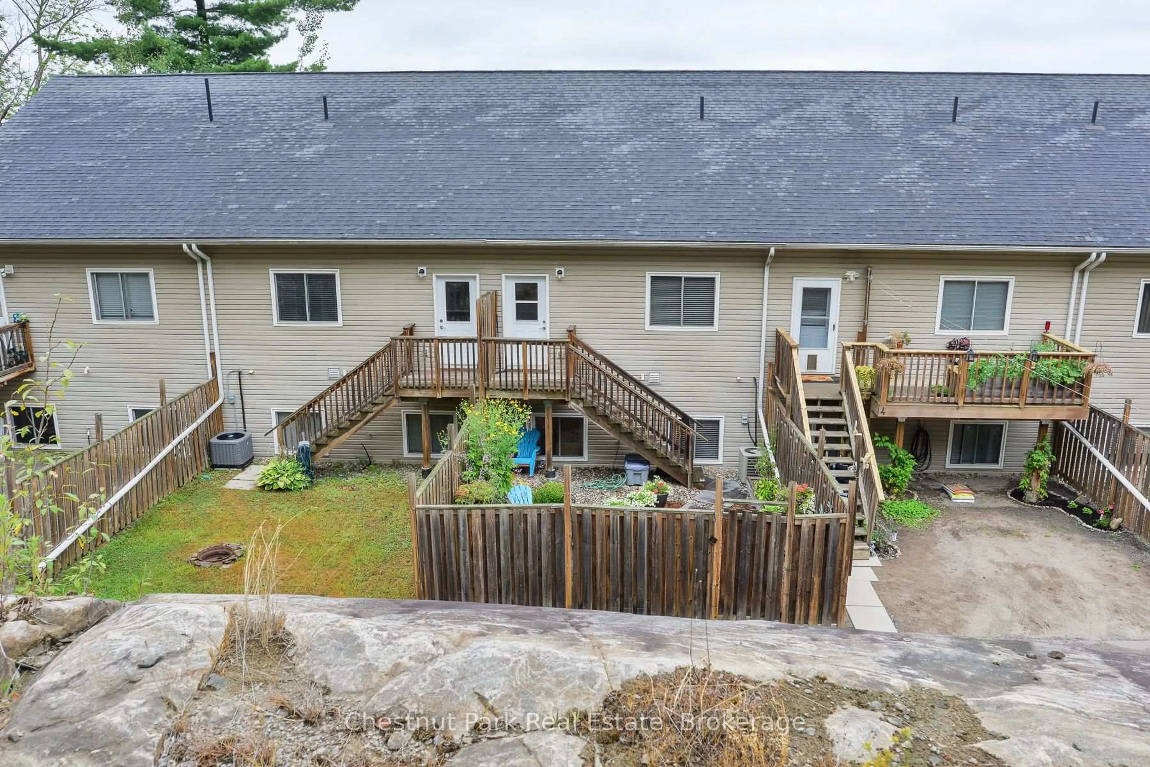 A pic from outside/outdoor area/front of a property/back of a property/a pic from drone, unknown for 99 Main St #5, Huntsville Ontario P1H 1X1