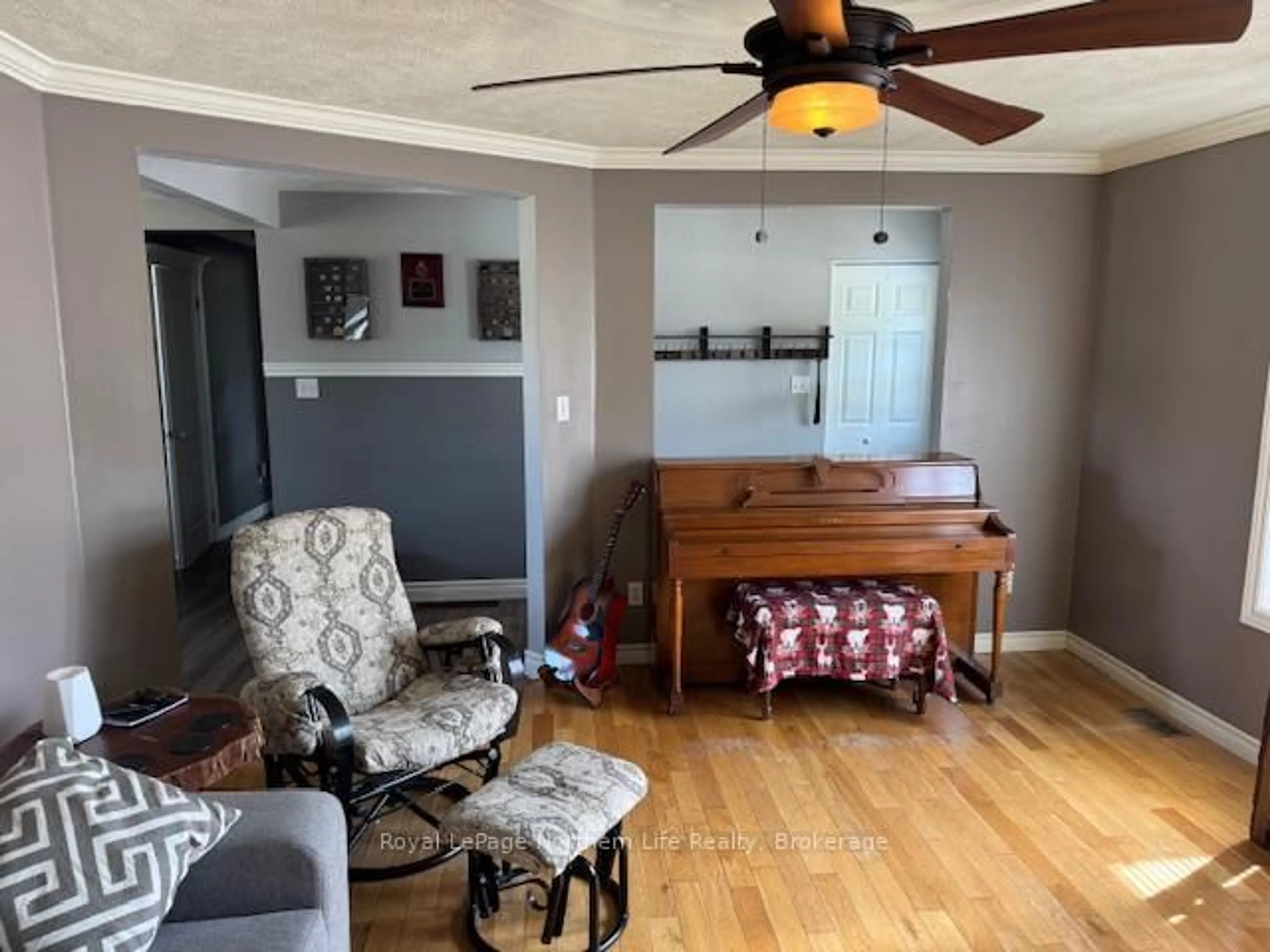 Living room with furniture, wood/laminate floor for 53 Waterfront Dr, West Nipissing Ontario P0H 1G0