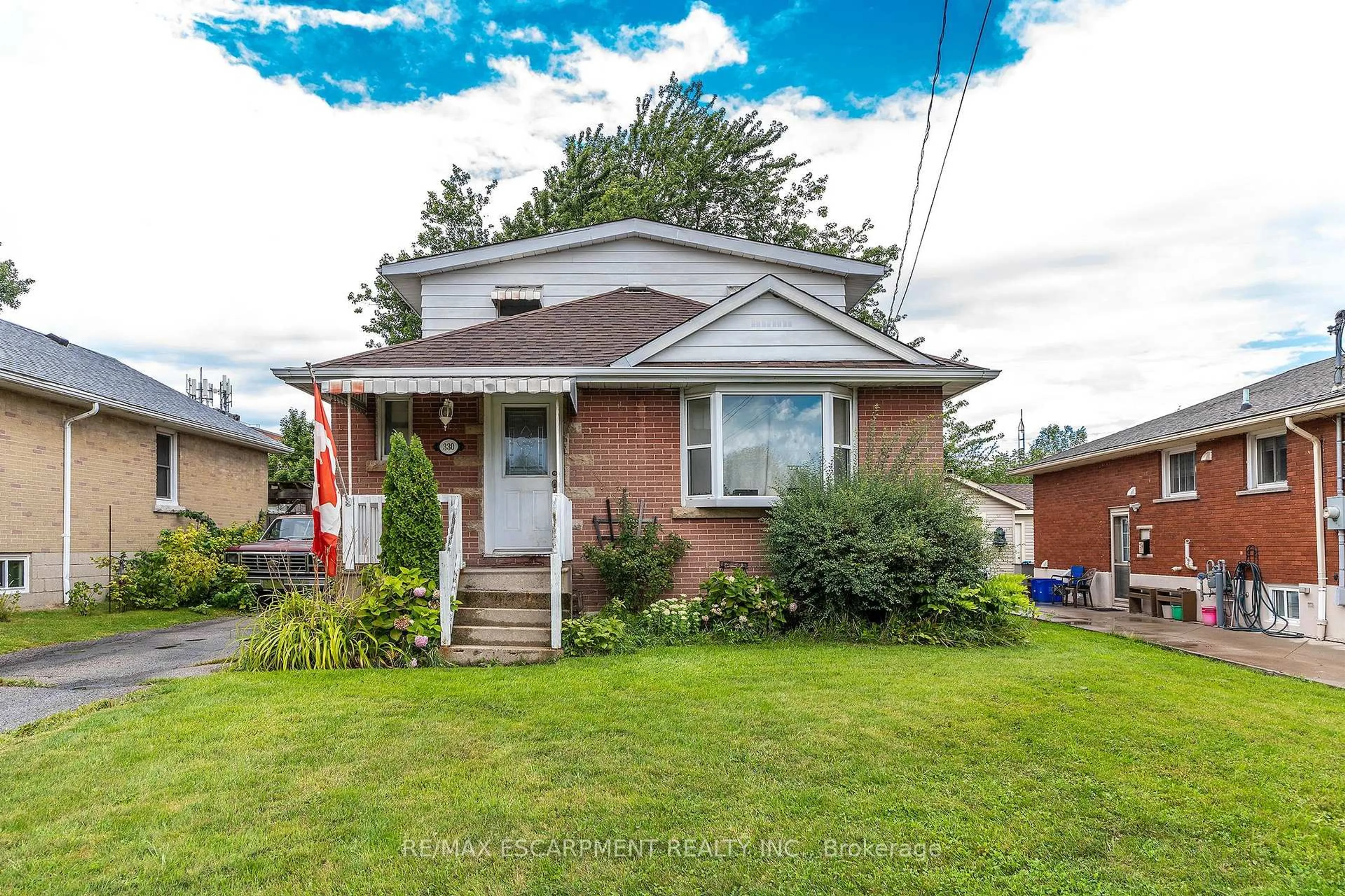 Home with brick exterior material, street for 330 East 15th St, Hamilton Ontario L9A 4G5