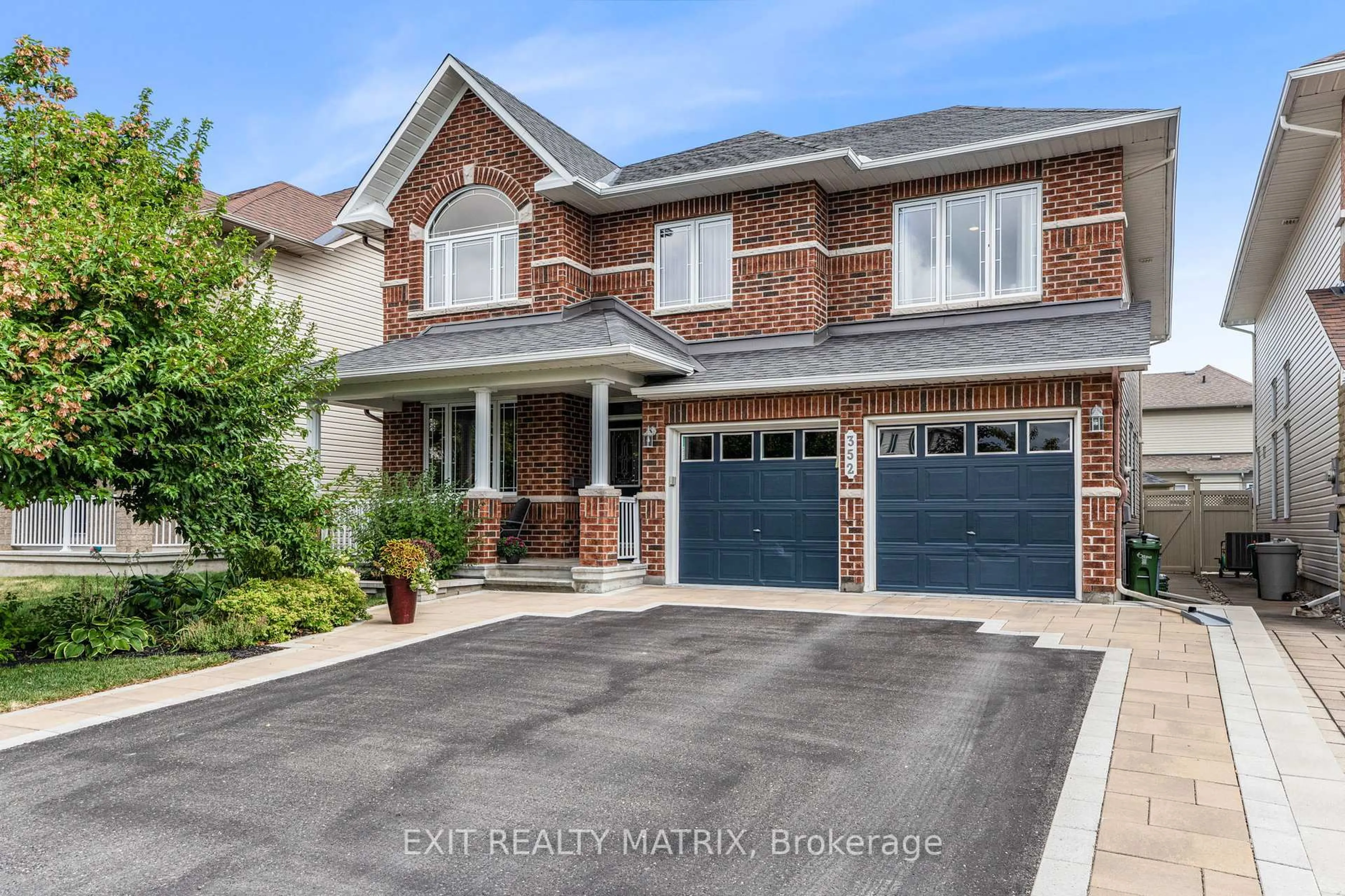 Home with brick exterior material, street for 352 Oakcrest Way, Ottawa Ontario K4A 0S5
