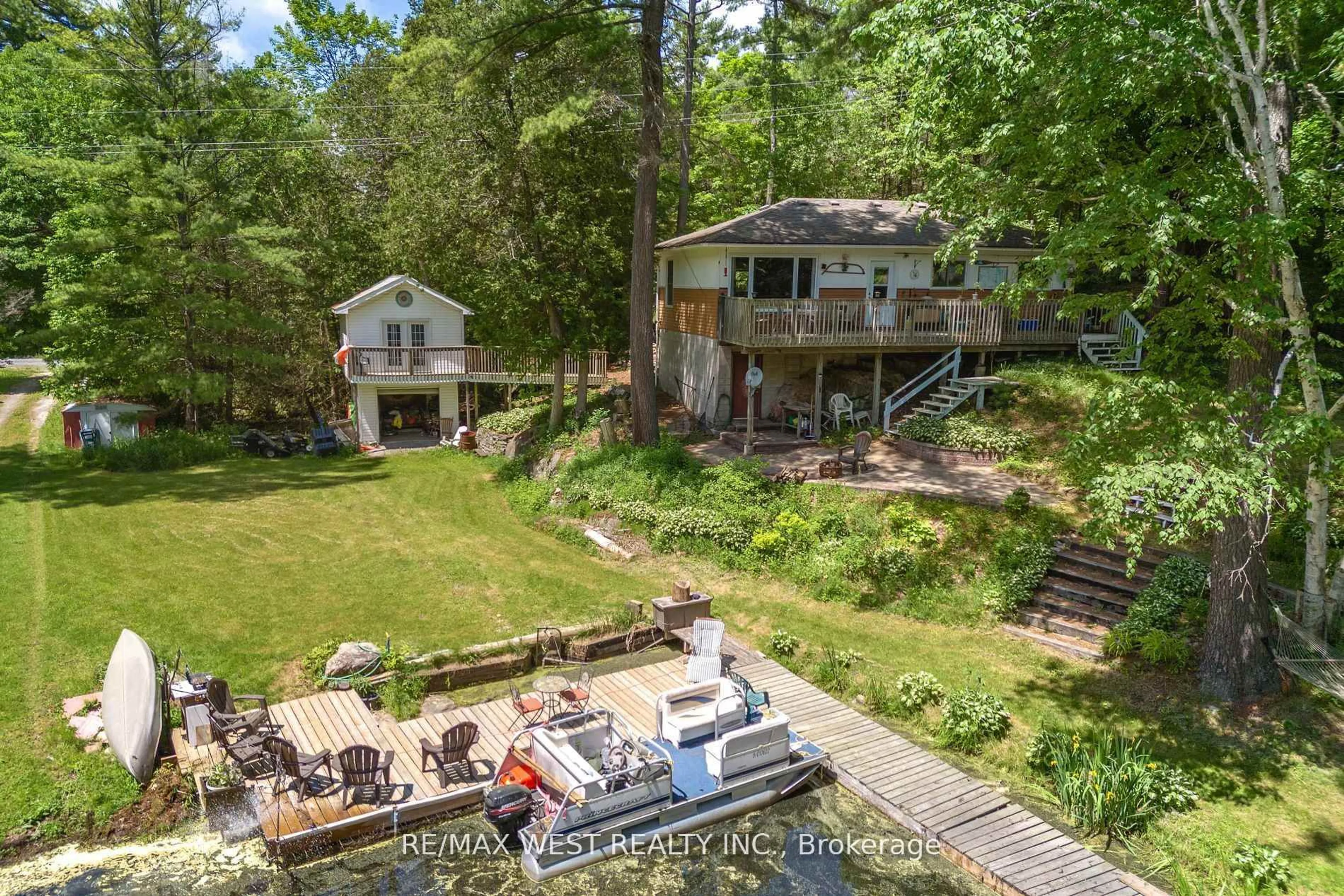 A pic from outside/outdoor area/front of a property/back of a property/a pic from drone, water/lake/river/ocean view for 2735 Shepherd Lane, Selwyn Ontario K0L 2H0