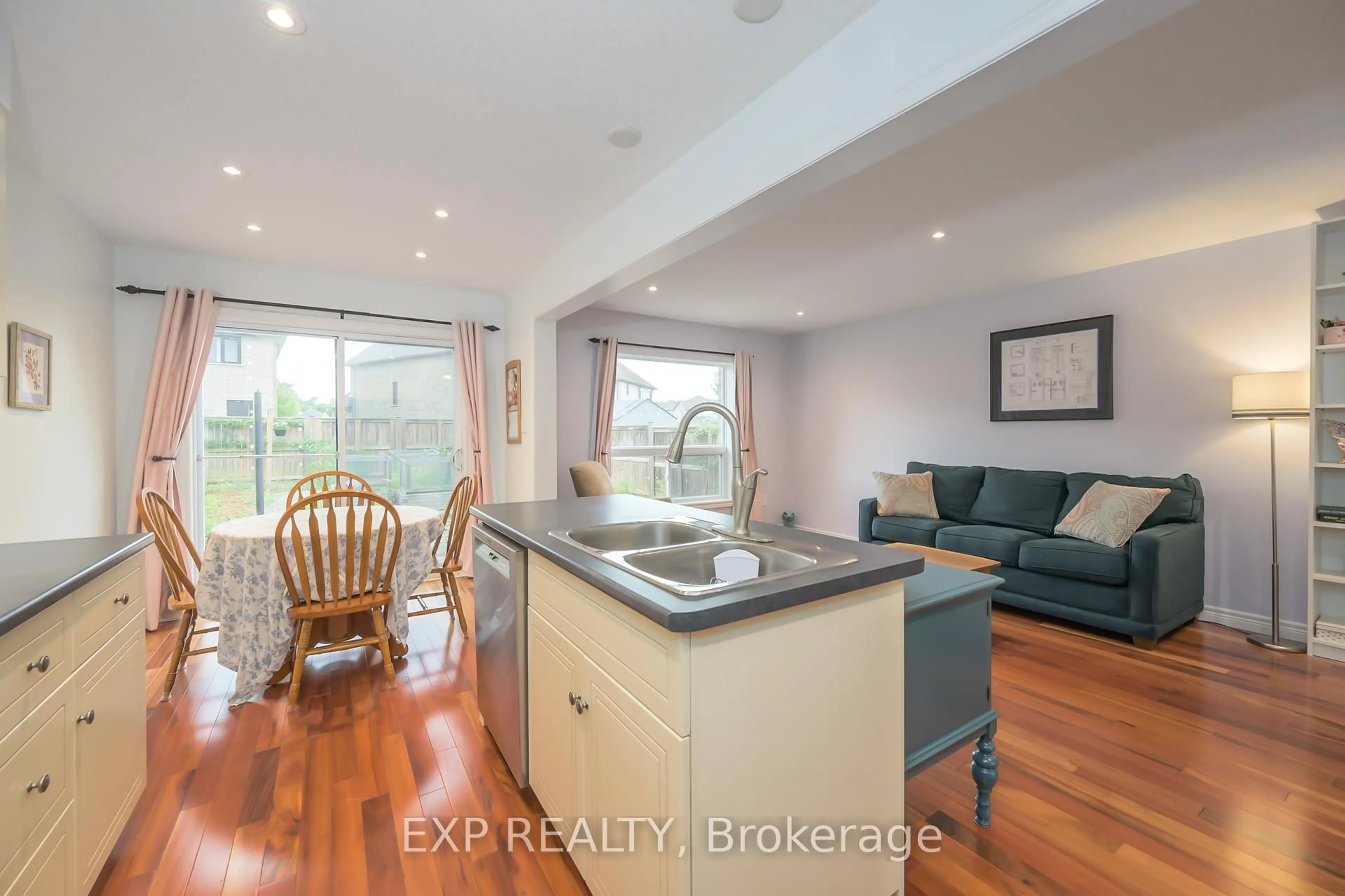 Open concept kitchen, wood/laminate floor for 1835 Reilly Walk, London North Ontario N5X 0H8