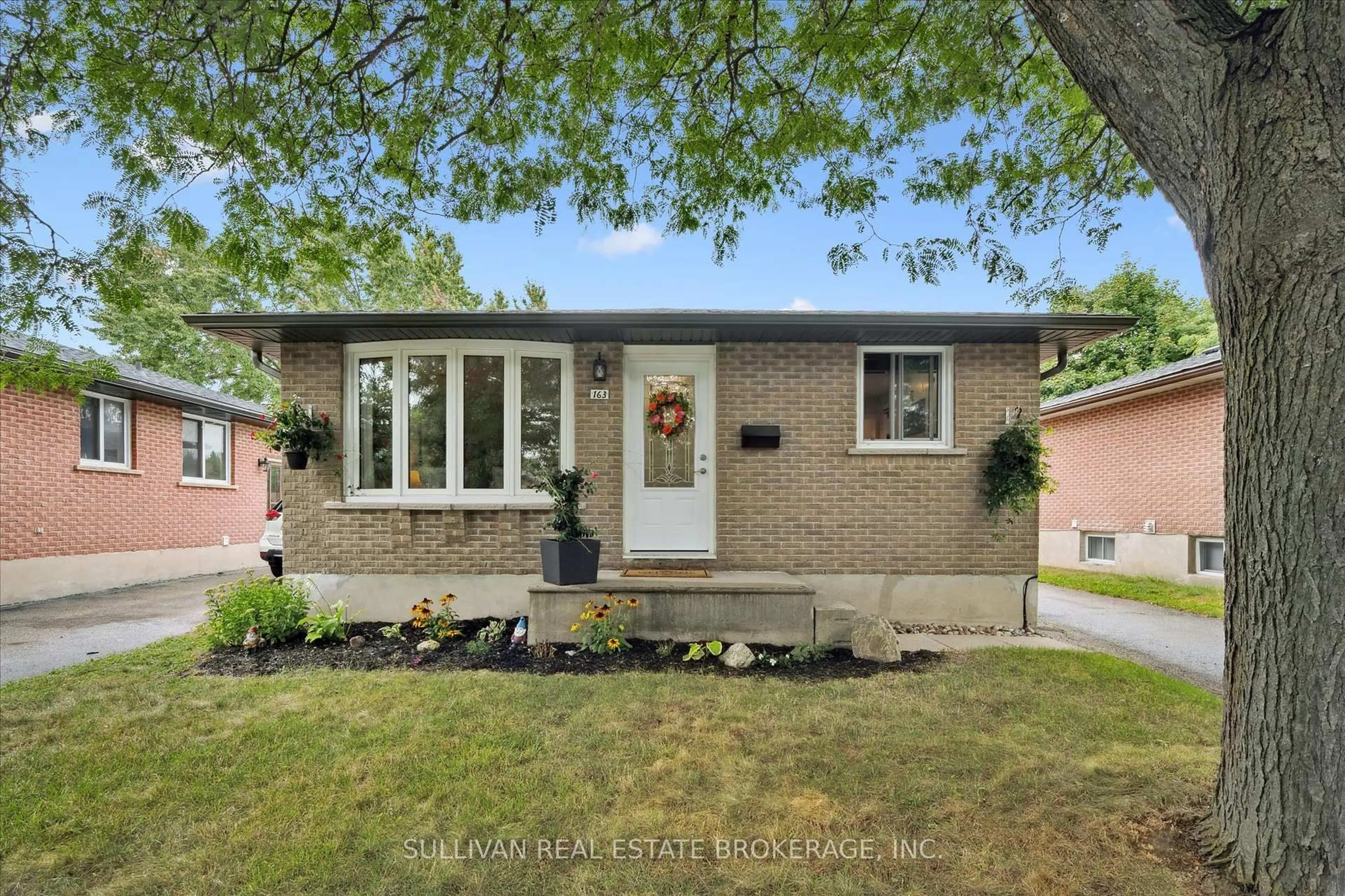 Home with brick exterior material, street for 163 Hadati Rd, Guelph Ontario N1E 6N3