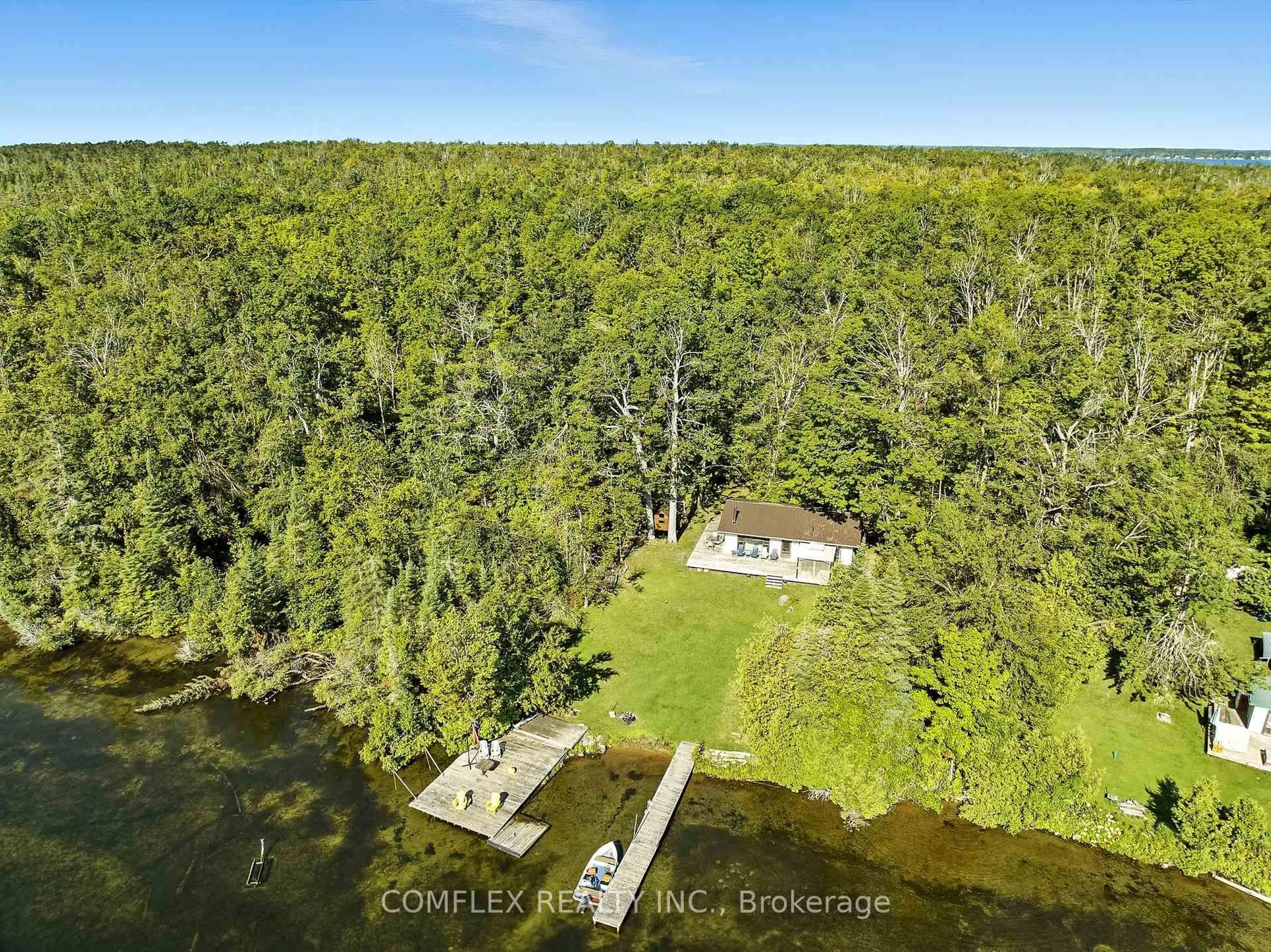 A pic from outside/outdoor area/front of a property/back of a property/a pic from drone, water/lake/river/ocean view for 633 Grand Island, Kawartha Lakes Ontario K0M 1G0