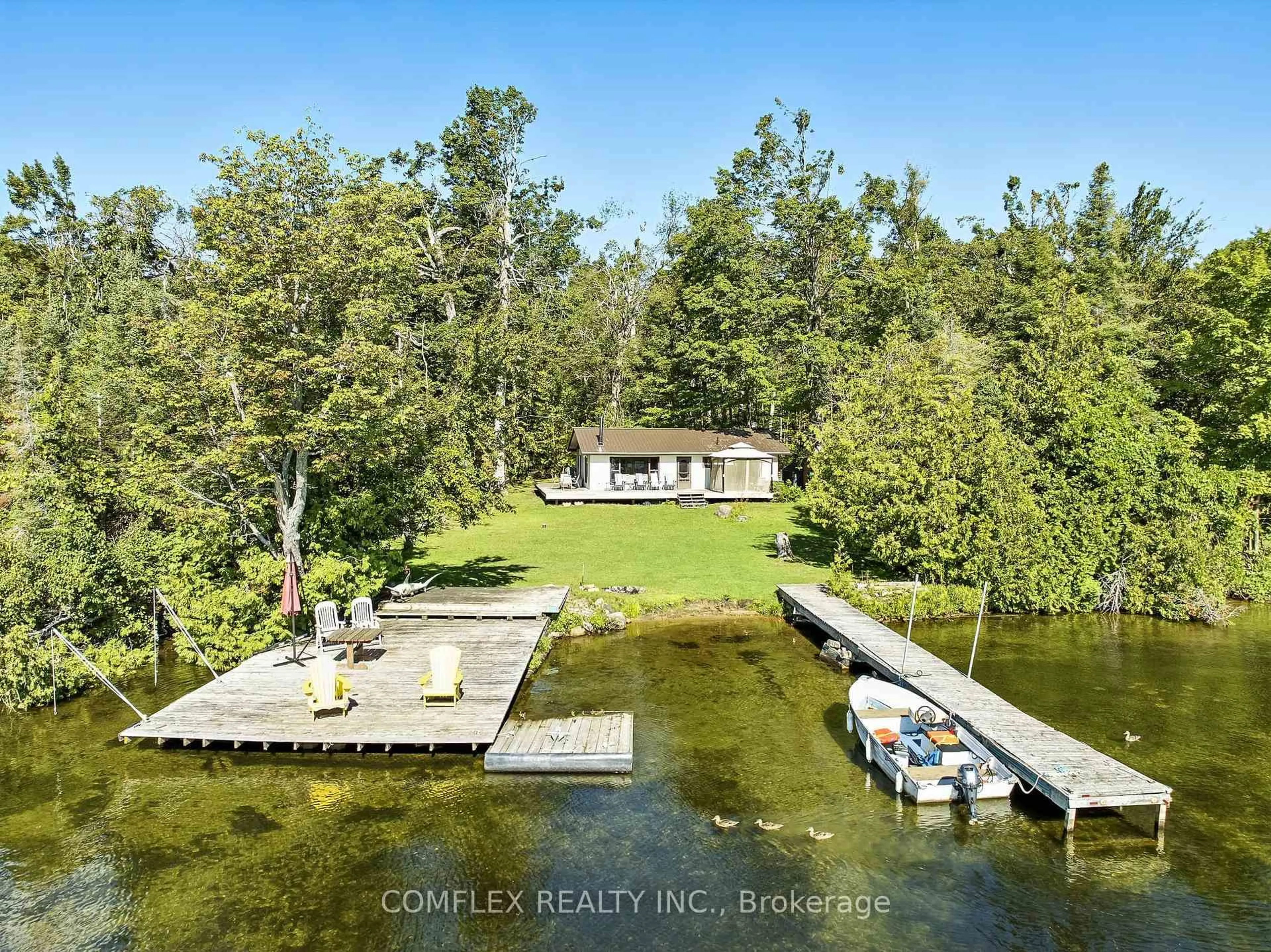 A pic from outside/outdoor area/front of a property/back of a property/a pic from drone, water/lake/river/ocean view for 633 Grand Island, Kawartha Lakes Ontario K0M 1G0