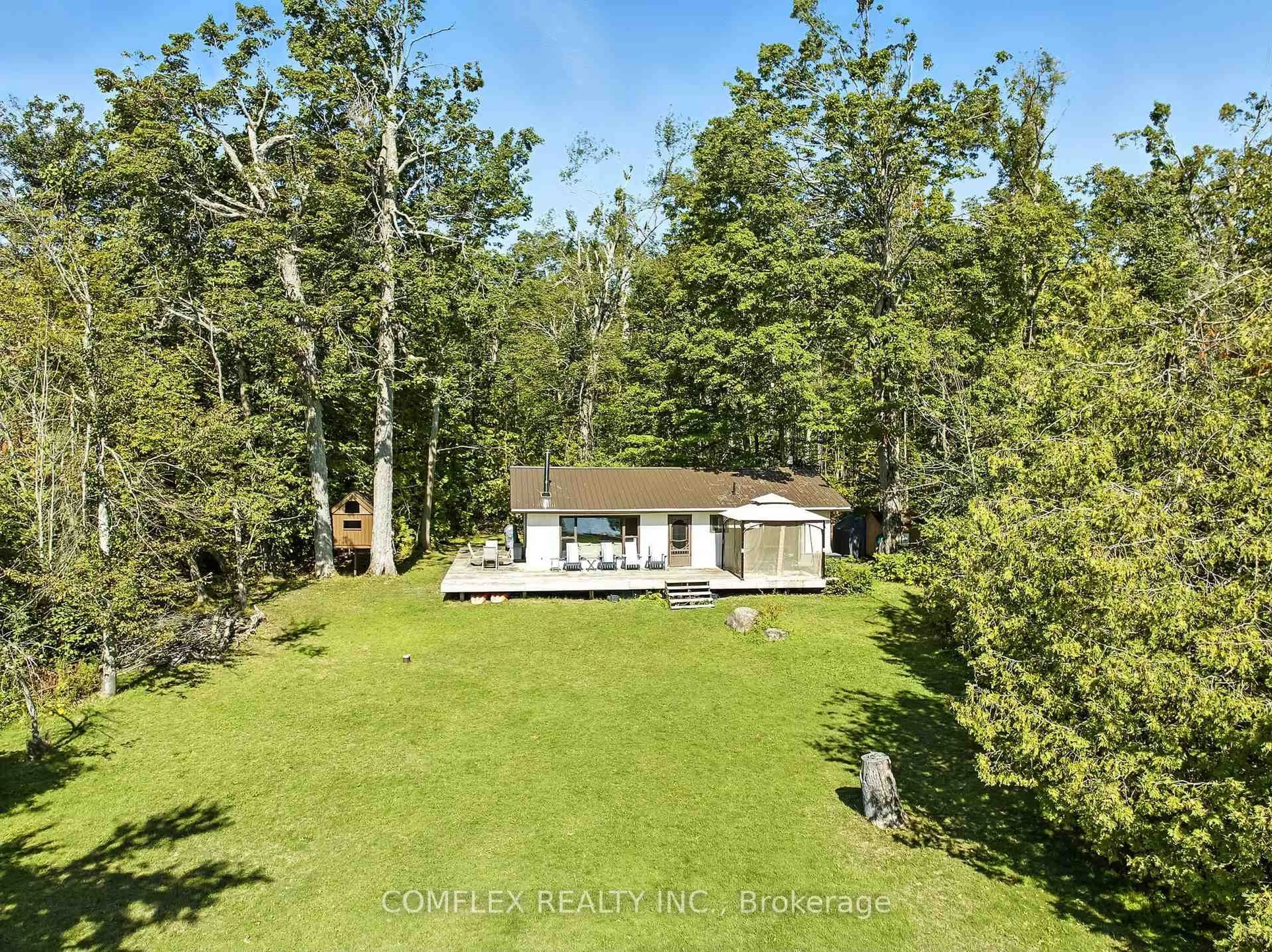 A pic from outside/outdoor area/front of a property/back of a property/a pic from drone, forest/trees view for 633 Grand Island, Kawartha Lakes Ontario K0M 1G0