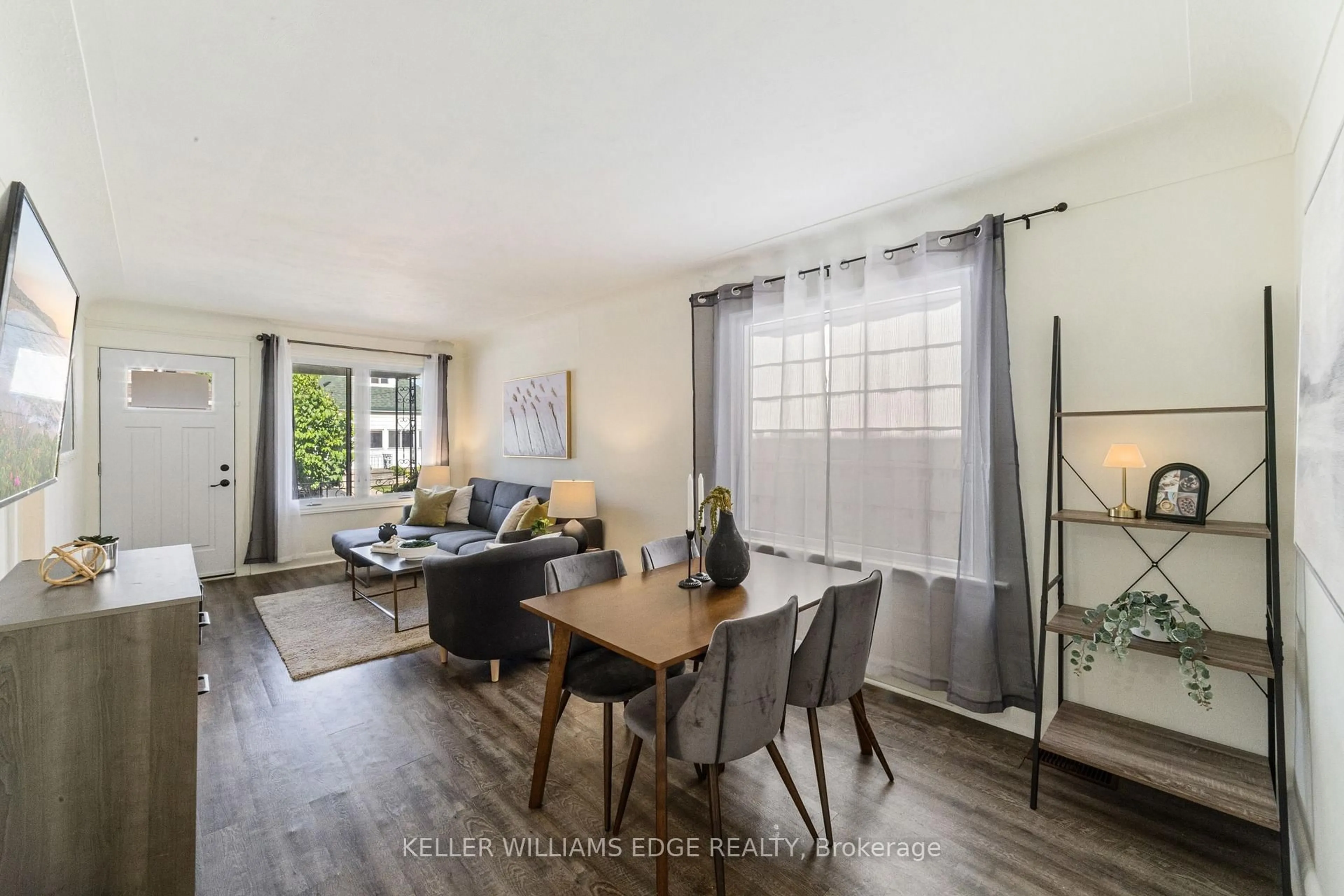 Living room with furniture, wood/laminate floor for 22 Houghton Ave, Hamilton Ontario L8H 4L2