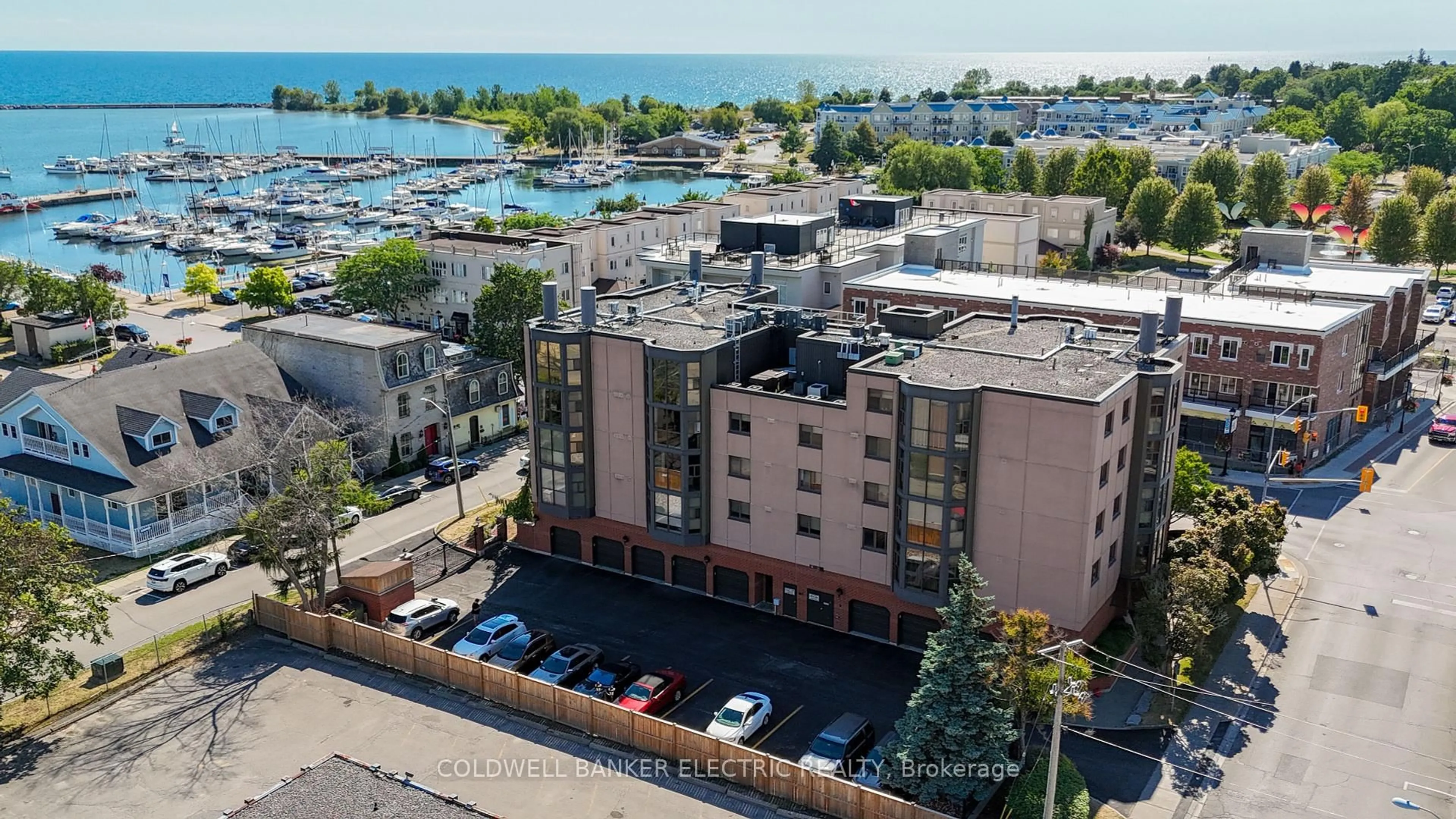 A pic from outside/outdoor area/front of a property/back of a property/a pic from drone, water/lake/river/ocean view for 1 Queen St #404, Cobourg Ontario K9A 1M8