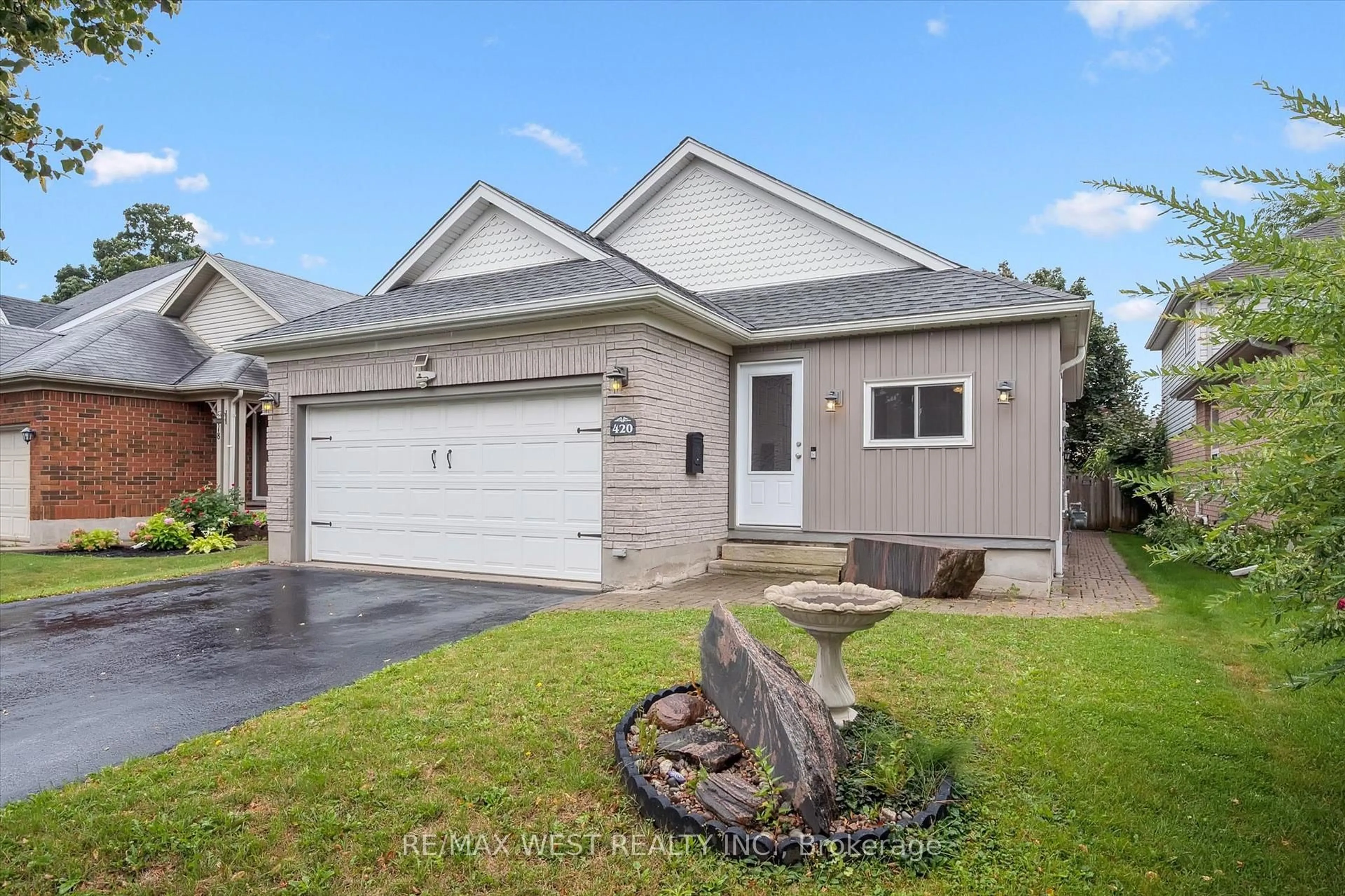 Home with vinyl exterior material, street for 420 Starwood Dr, Guelph Ontario N1E 7A4
