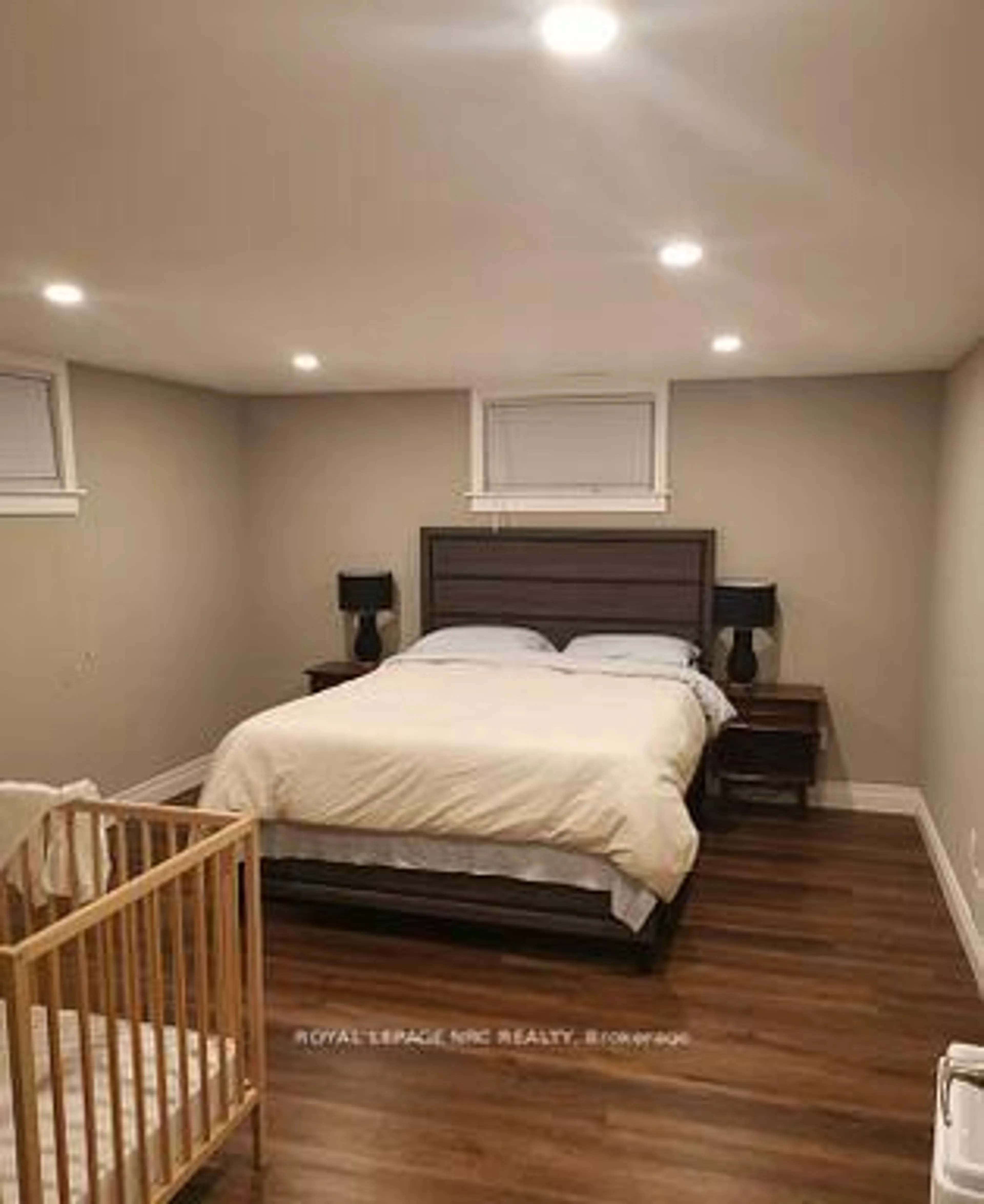 Bedroom with bed, wood/laminate floor for 6437 Margaret St, Niagara Falls Ontario L2G 2T6