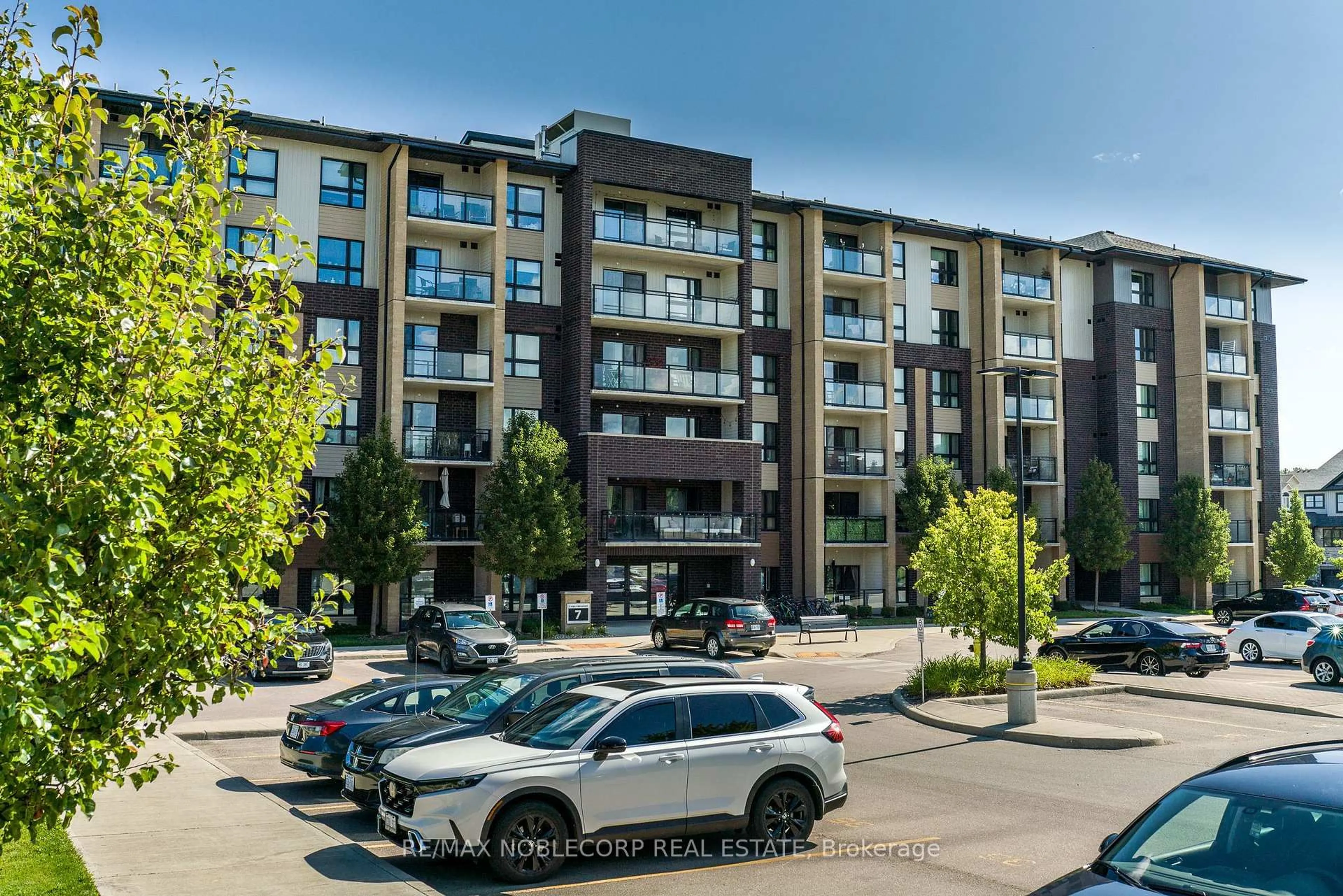 A pic from outside/outdoor area/front of a property/back of a property/a pic from drone, street for 7 Kay Cres #504, Guelph Ontario N1L 0P9