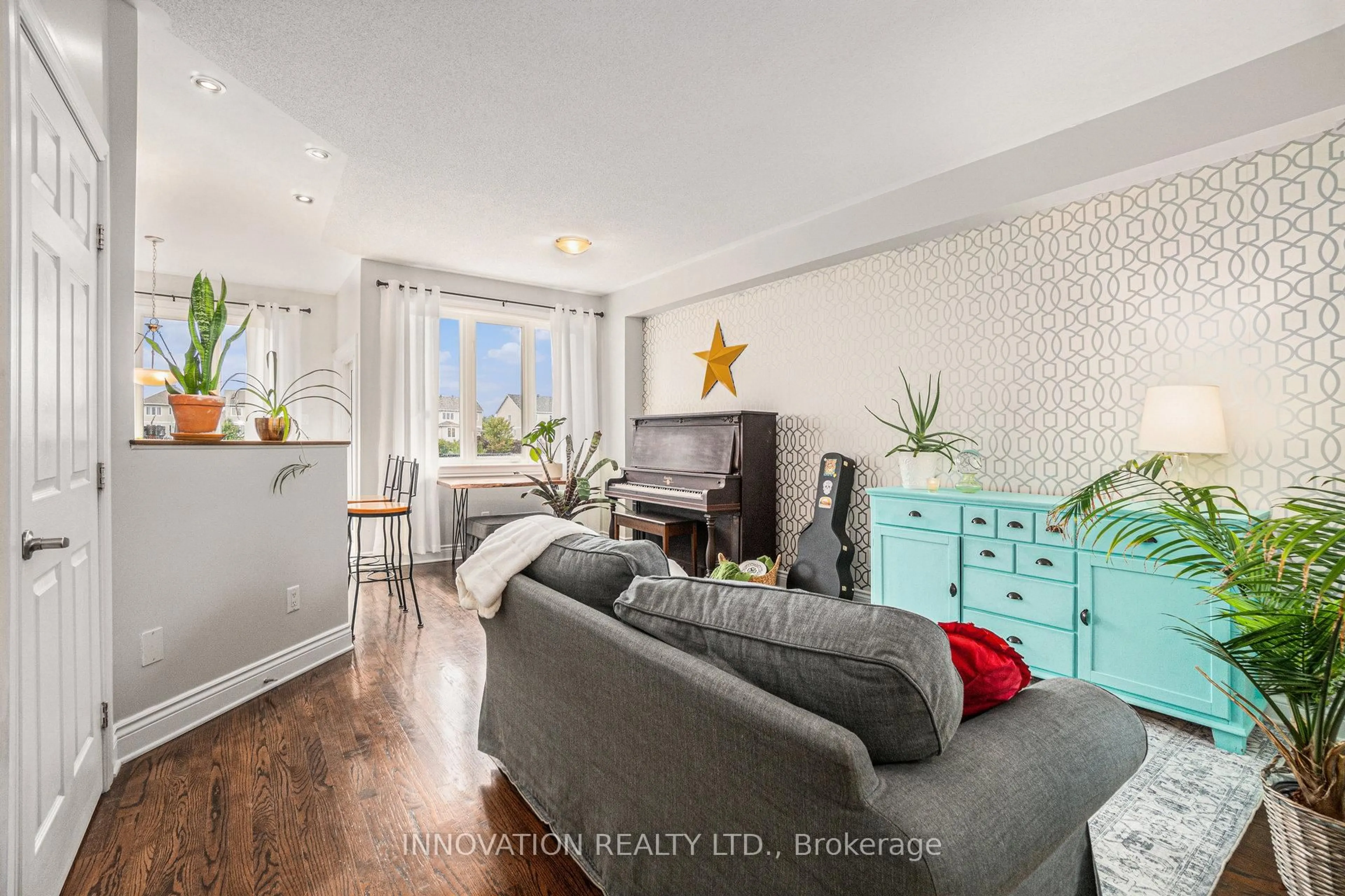 Living room with furniture, wood/laminate floor for 41 Mcgregor Scobie Cres, Arnprior Ontario K7S 0G5