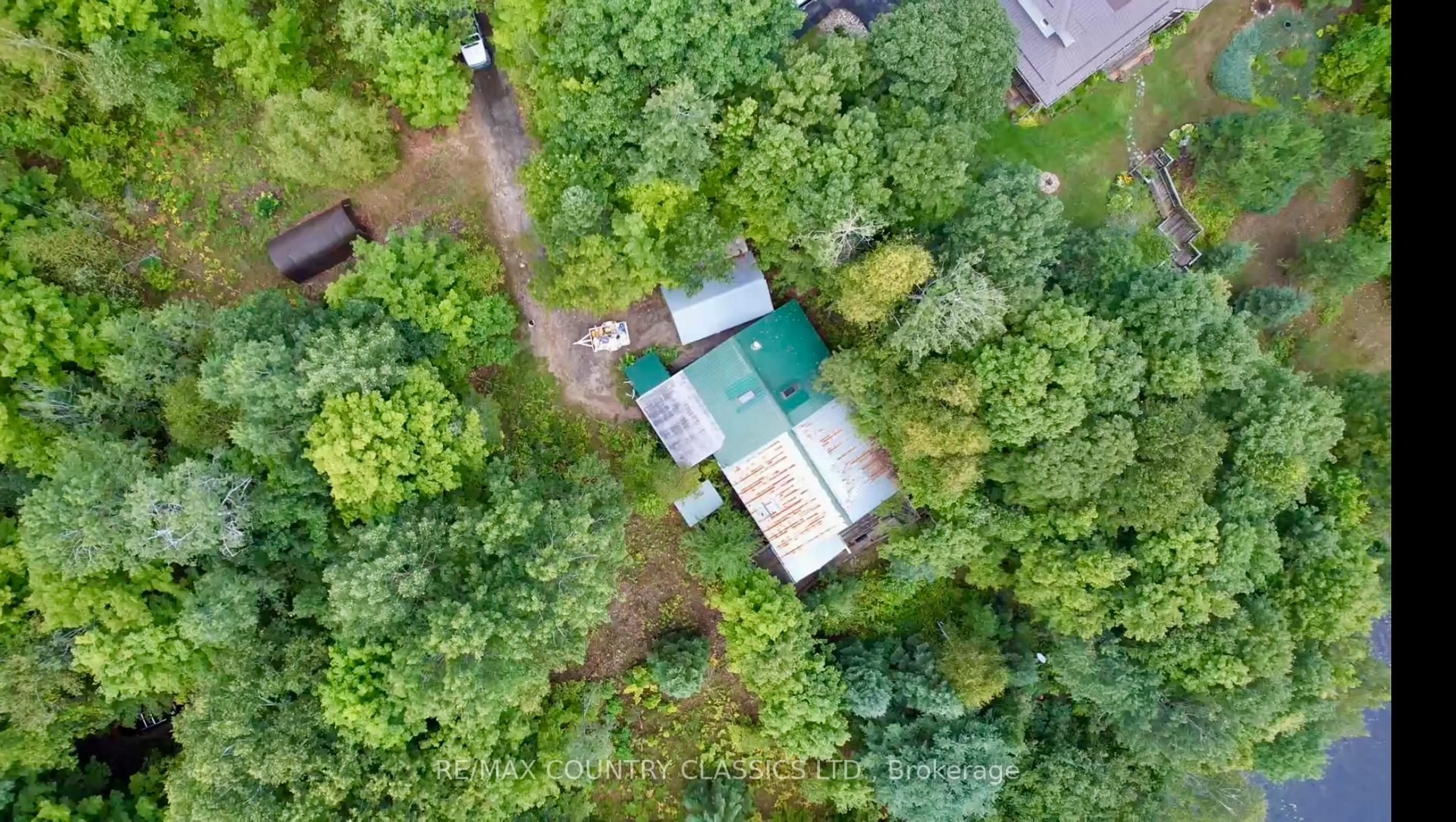 A pic from outside/outdoor area/front of a property/back of a property/a pic from drone, forest/trees view for 256 Elgin Rd, Maynooth Ontario K0L 2K0