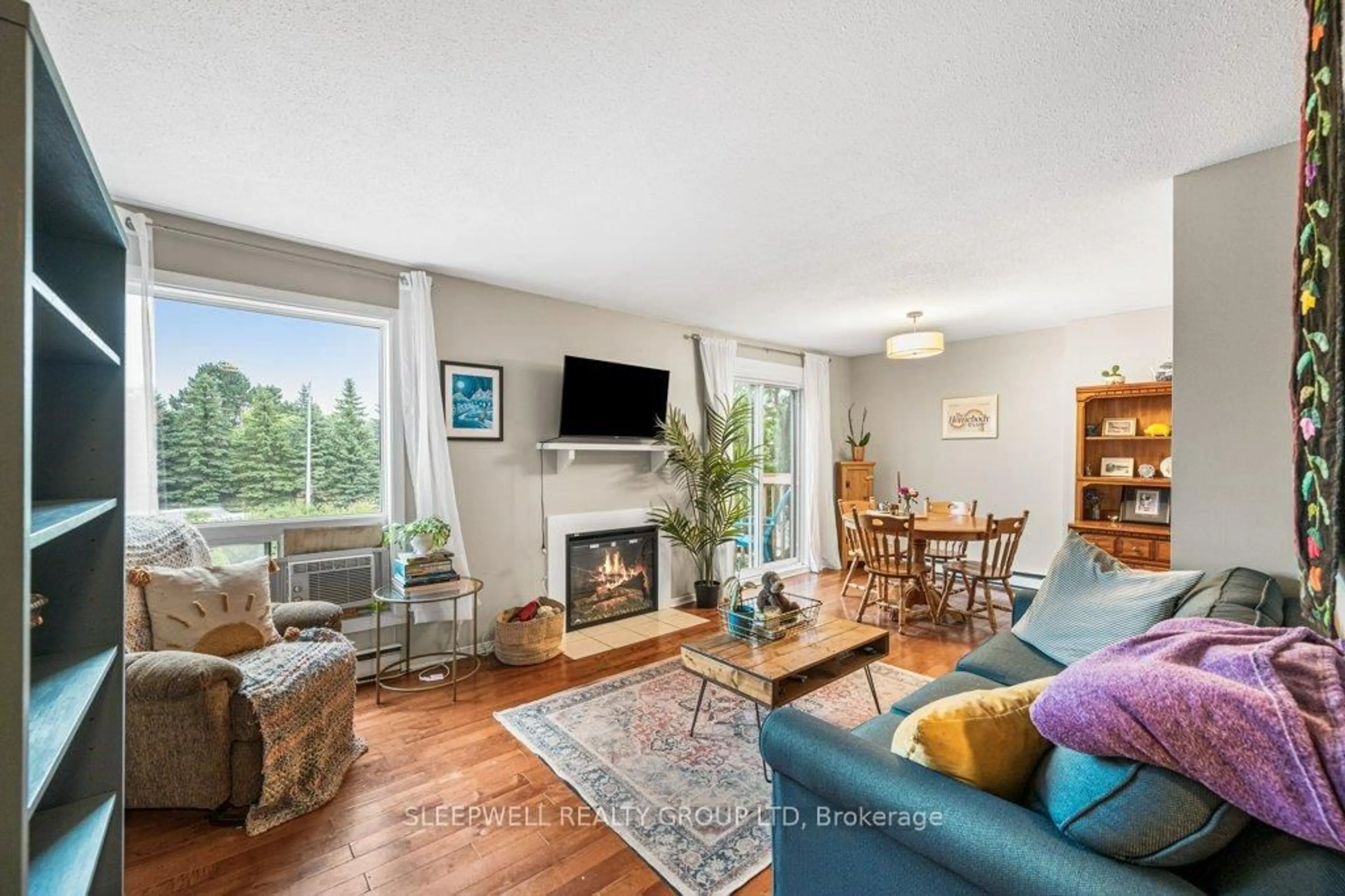 Living room with furniture, wood/laminate floor for 420 Fenerty Crt #7, Kanata Ontario K2L 3A9