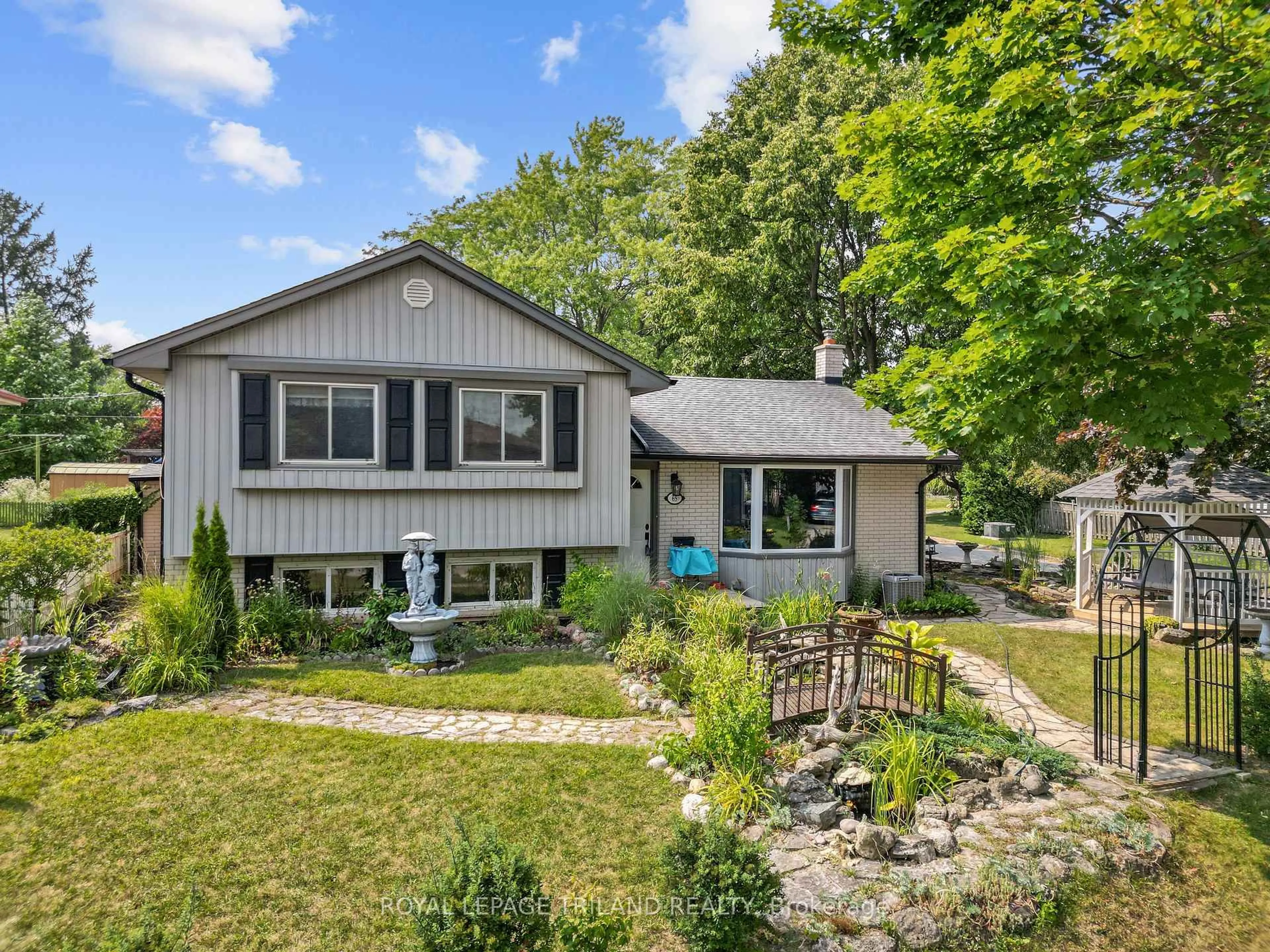Home with vinyl exterior material, street for 65 Almond Rd, London South Ontario N5Z 4C7