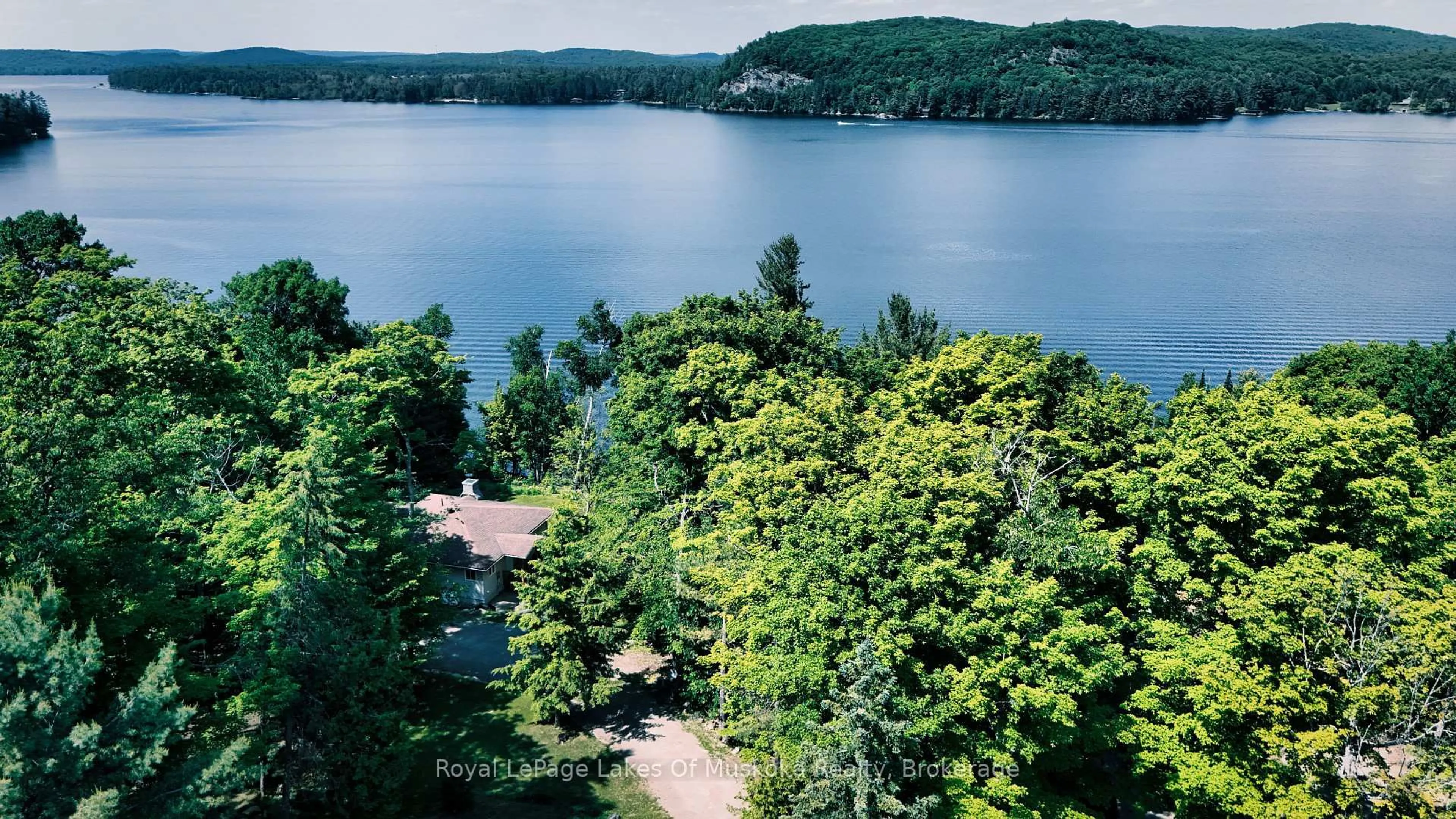 A pic from outside/outdoor area/front of a property/back of a property/a pic from drone, water/lake/river/ocean view for 4441 Muskoka Rd 117 Rd, Lake of Bays Ontario P0B 1A0