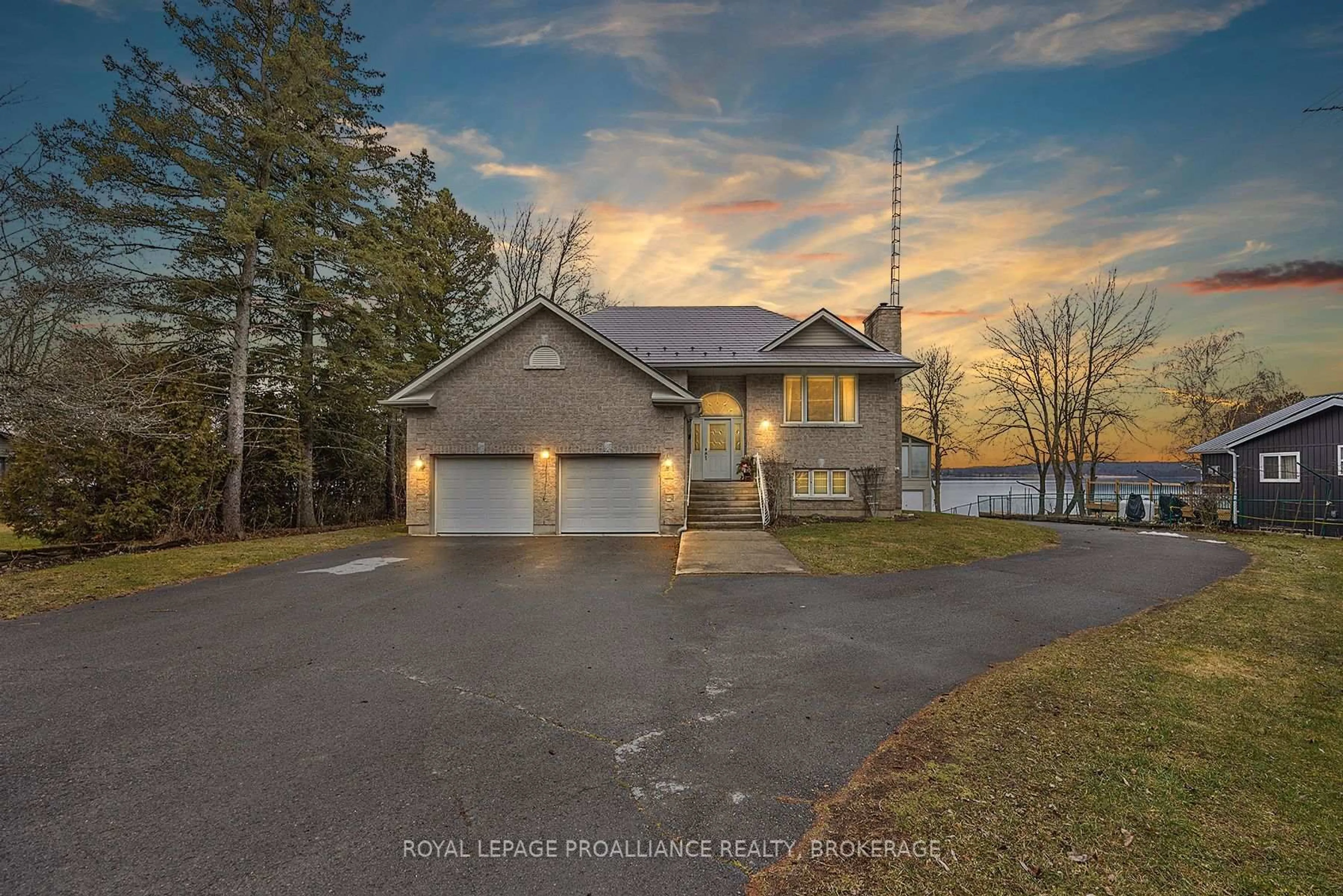 A pic from outside/outdoor area/front of a property/back of a property/a pic from drone, water/lake/river/ocean view for 1 Leavis Shores, Gananoque Ontario K7G 2V6
