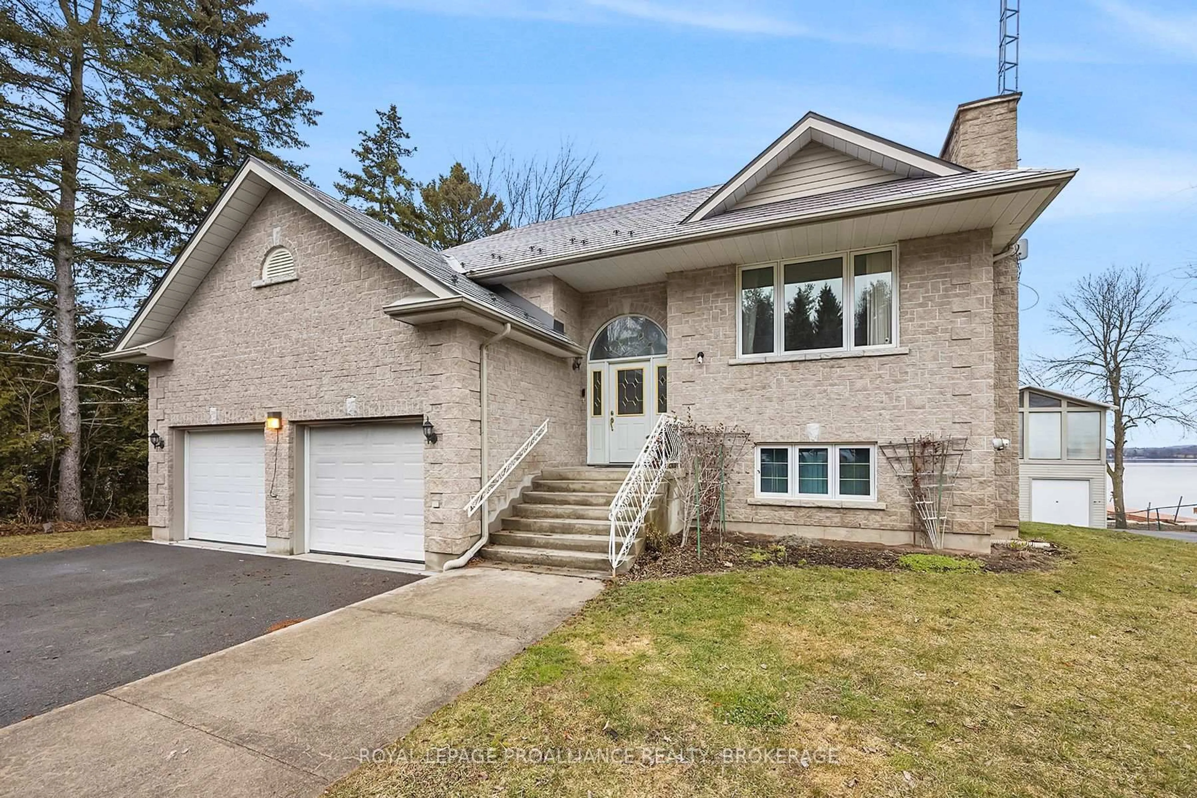 Home with brick exterior material, street for 1 Leavis Shores, Gananoque Ontario K7G 2V6