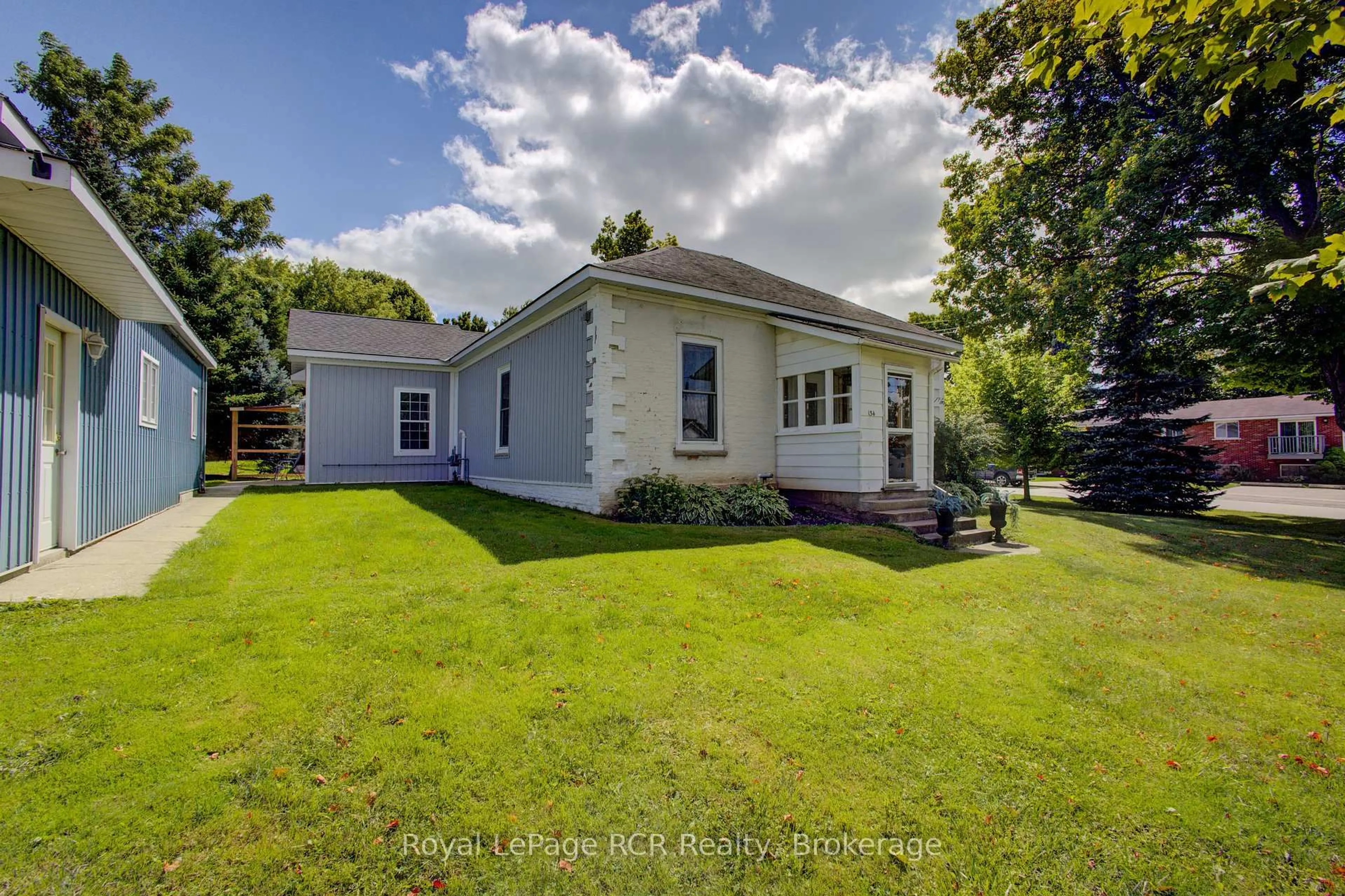 A pic from outside/outdoor area/front of a property/back of a property/a pic from drone, water/lake/river/ocean view for 134 Frederick St, Wellington North Ontario N0G 1A0