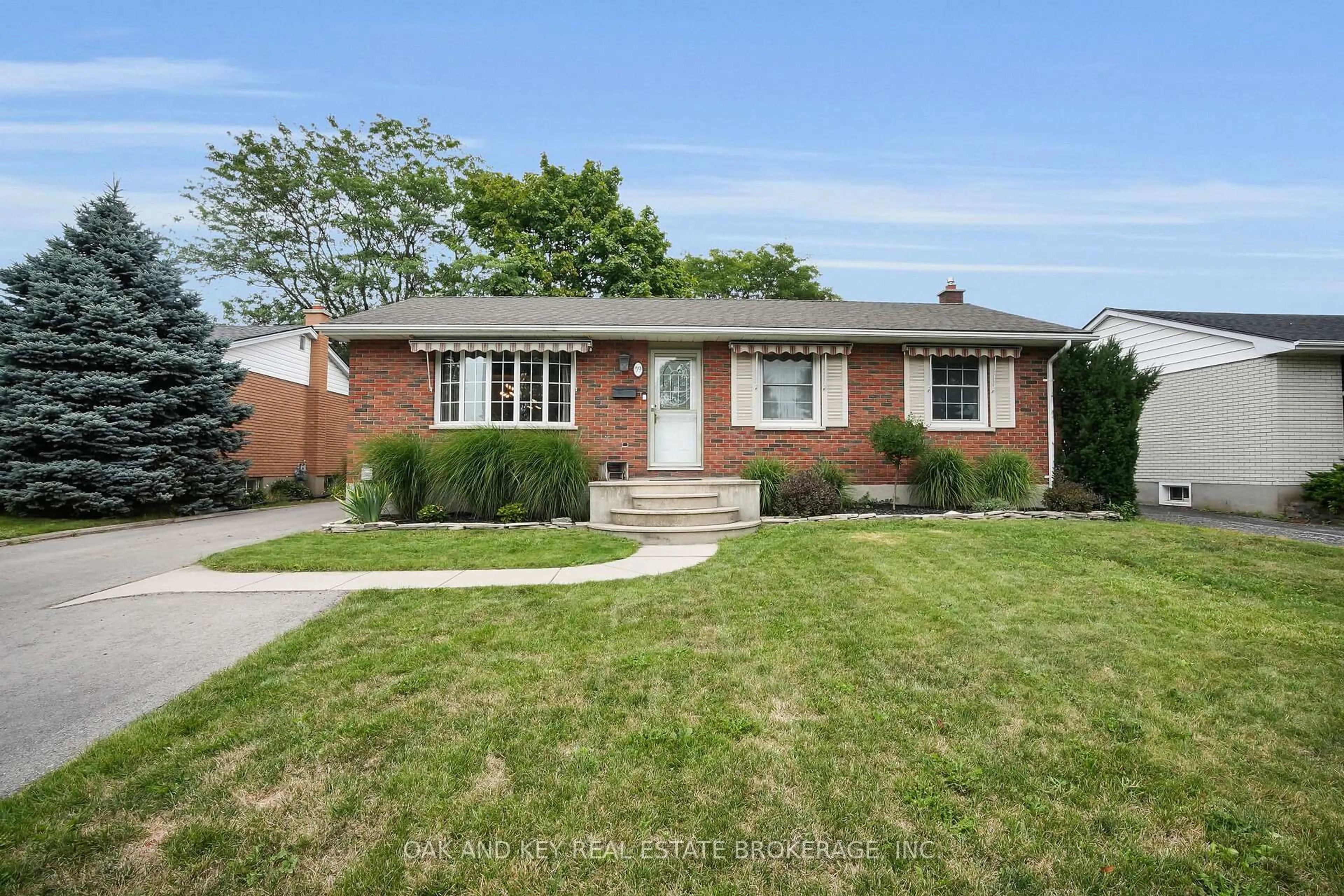 Home with brick exterior material, street for 59 Dunwich Dr, St. Thomas Ontario N5R 4T7