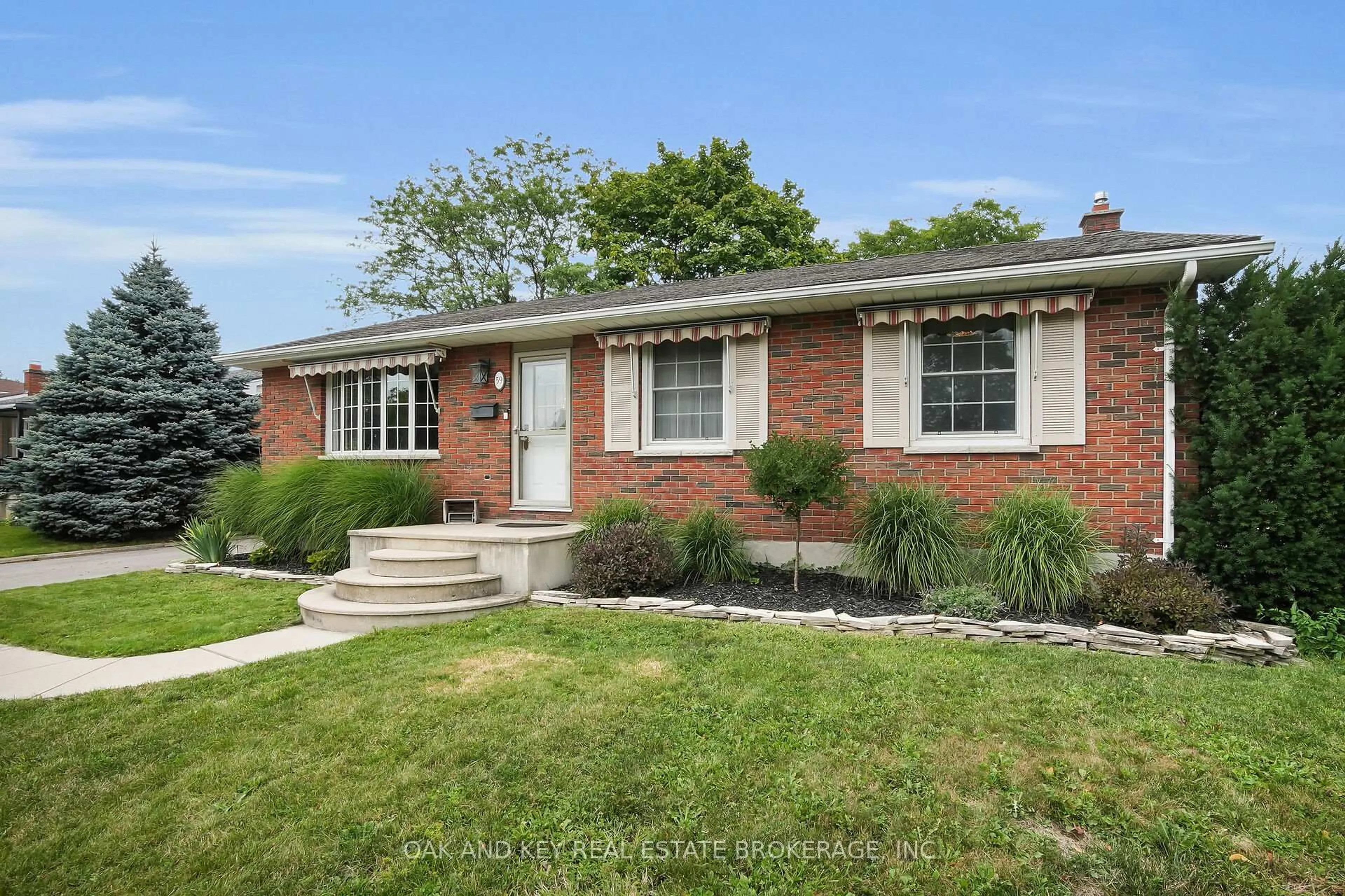 Home with brick exterior material, street for 59 Dunwich Dr, St. Thomas Ontario N5R 4T7