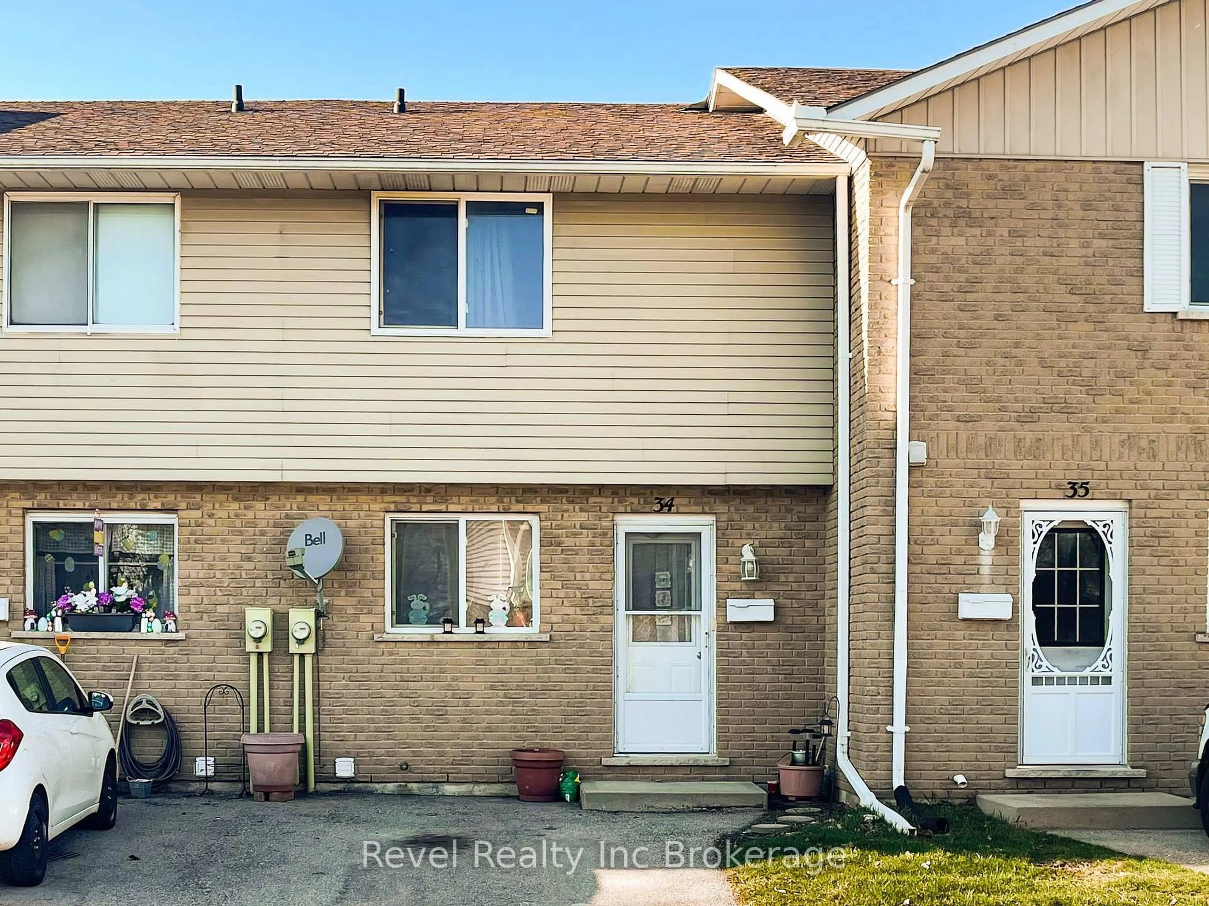 Home with vinyl exterior material, street for 1059 Nellis St #34, Woodstock Ontario N4S 8P2