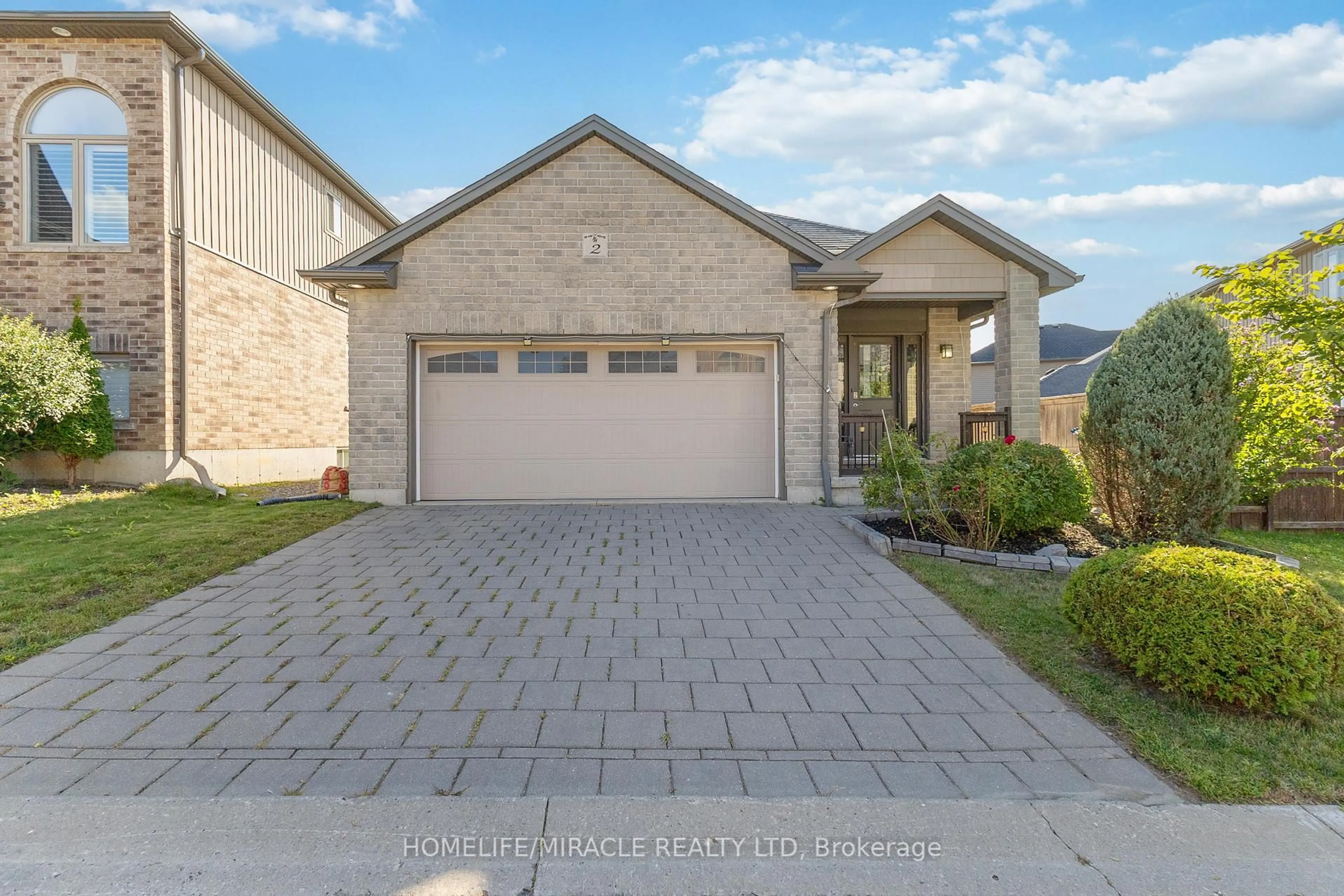 Home with brick exterior material, street for 70 Tanoak Dr #2, London North Ontario N6G 5R3