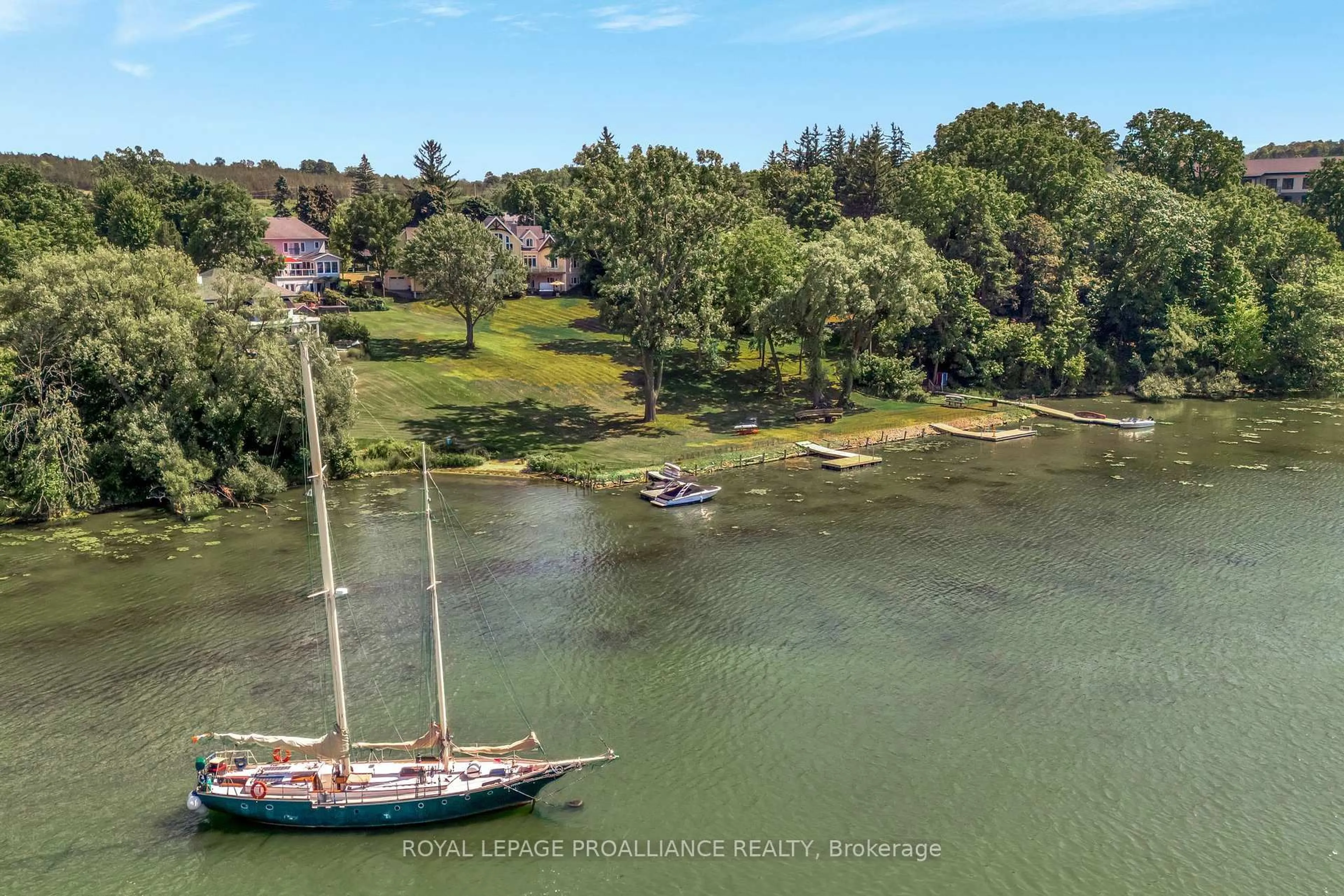 A pic from outside/outdoor area/front of a property/back of a property/a pic from drone, water/lake/river/ocean view for 12698 Loyalist Pkwy, Prince Edward County Ontario K0K 2T0