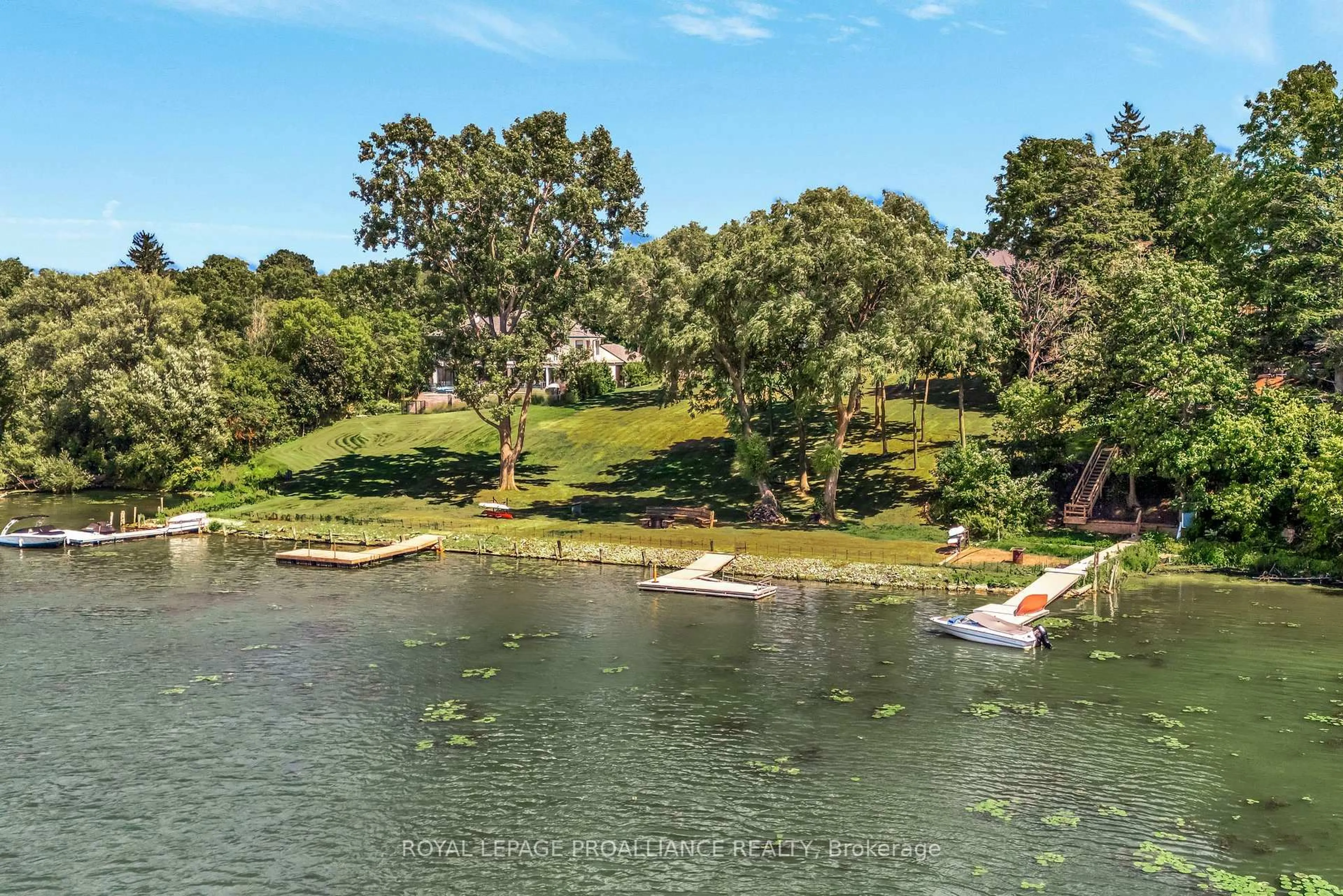 A pic from outside/outdoor area/front of a property/back of a property/a pic from drone, water/lake/river/ocean view for 12698 Loyalist Pkwy, Prince Edward County Ontario K0K 2T0