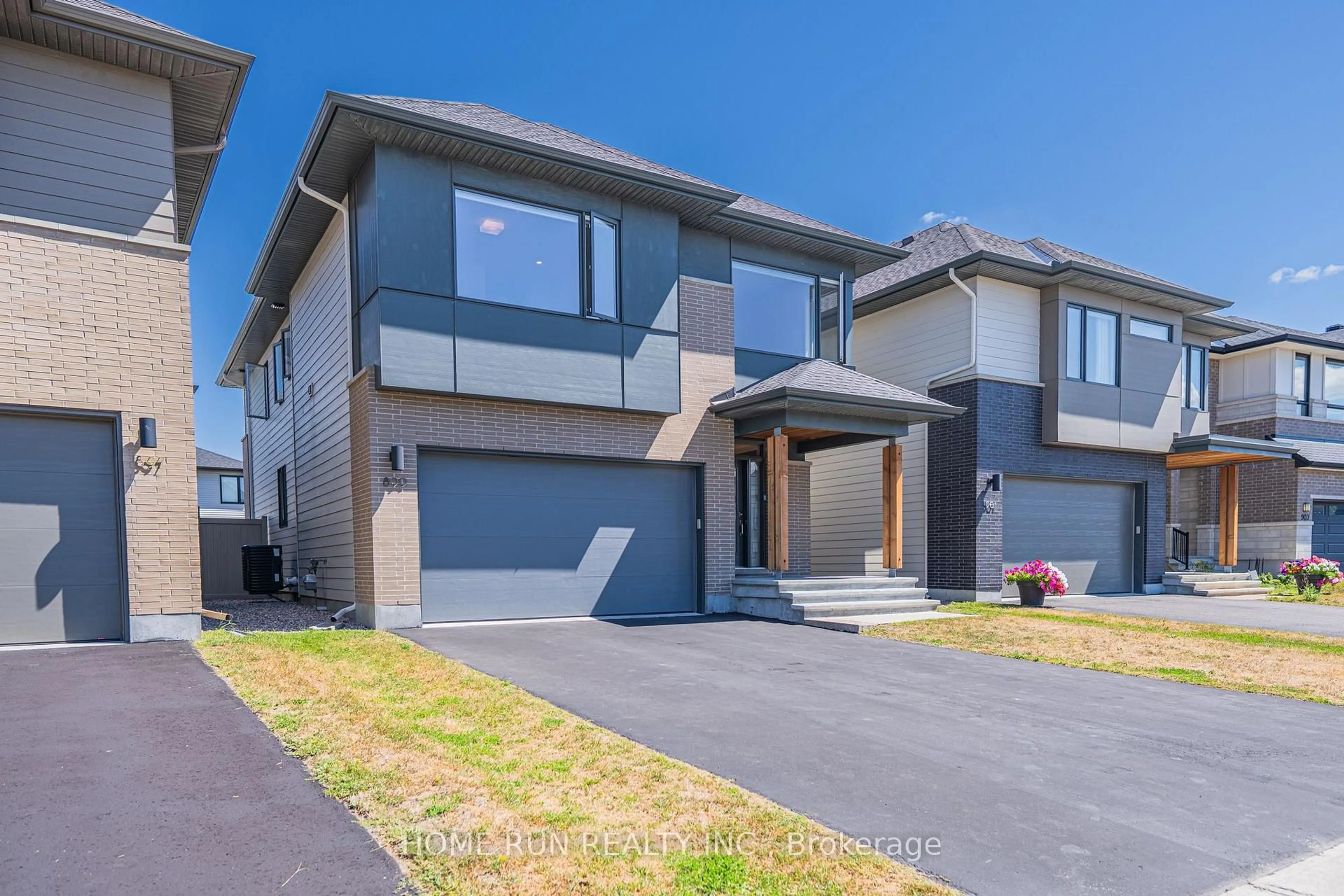 Home with brick exterior material, street for 899 Ralph Hennessy Ave, Ottawa Ontario K1X 0B1