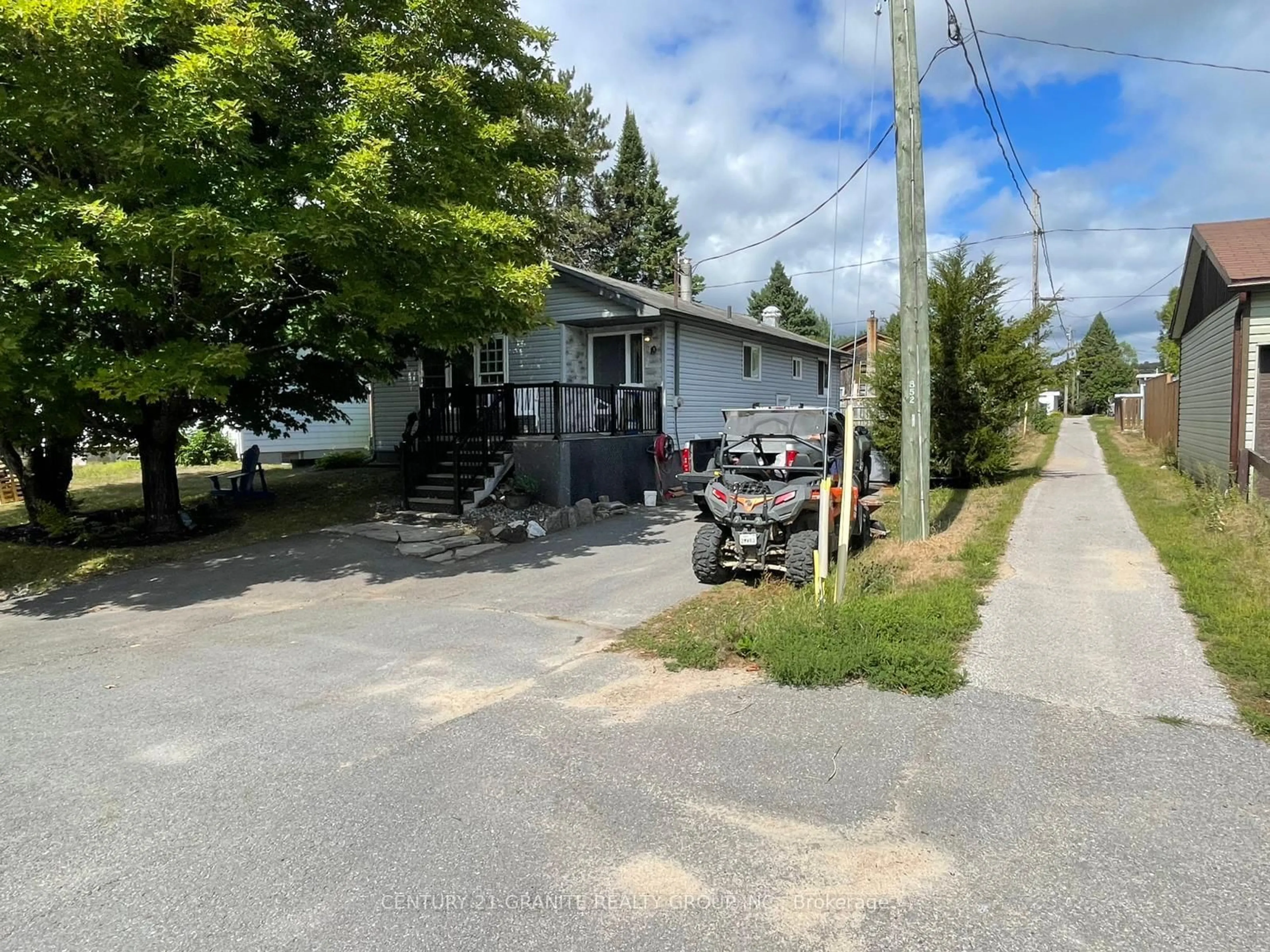 A pic from outside/outdoor area/front of a property/back of a property/a pic from drone, street for 10 Magnolia St, Highlands East Ontario K0L 1M0