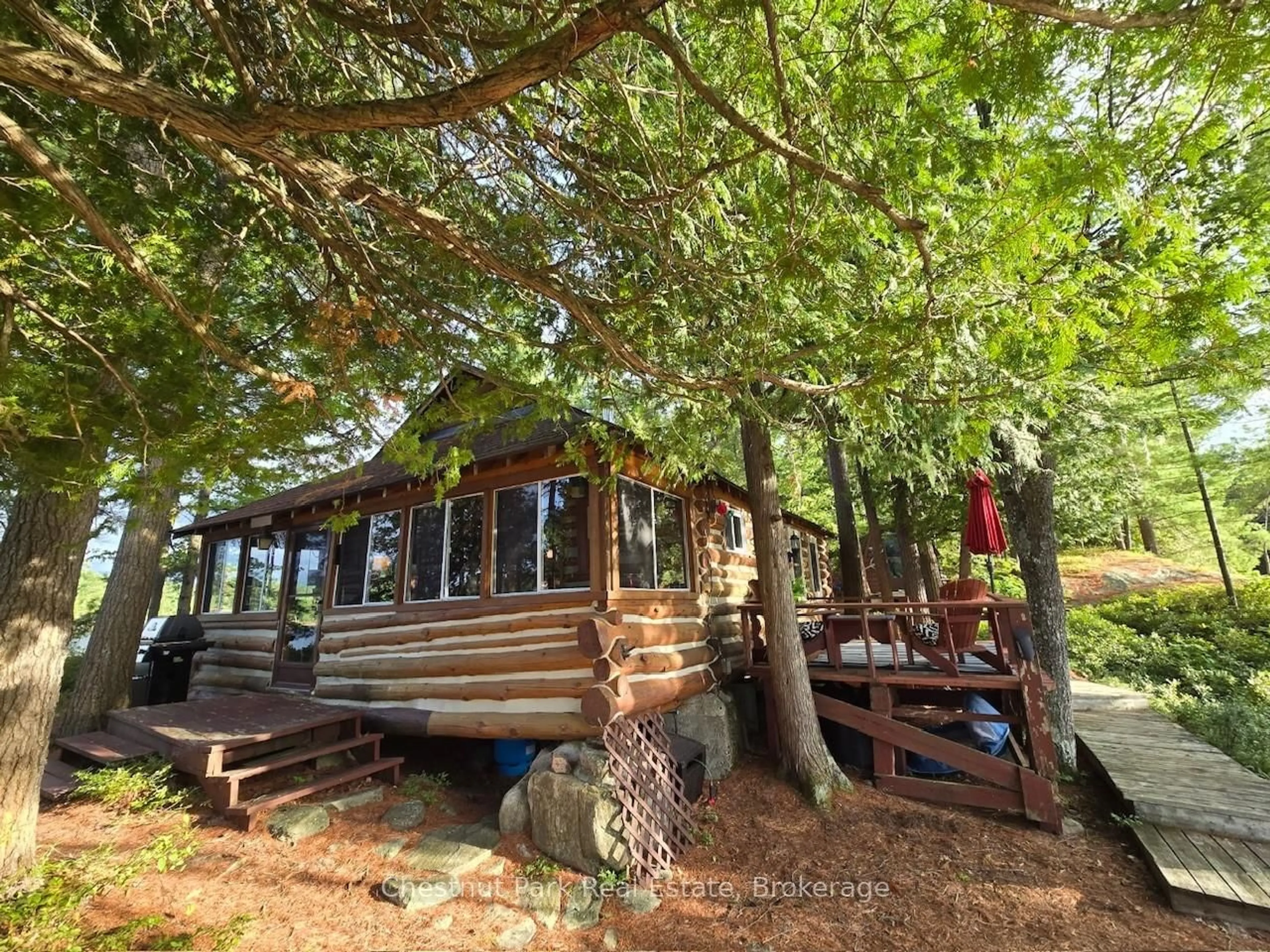 A pic from outside/outdoor area/front of a property/back of a property/a pic from drone, forest/trees view for 10 Island 21kl, Gravenhurst Ontario P0E 1G0