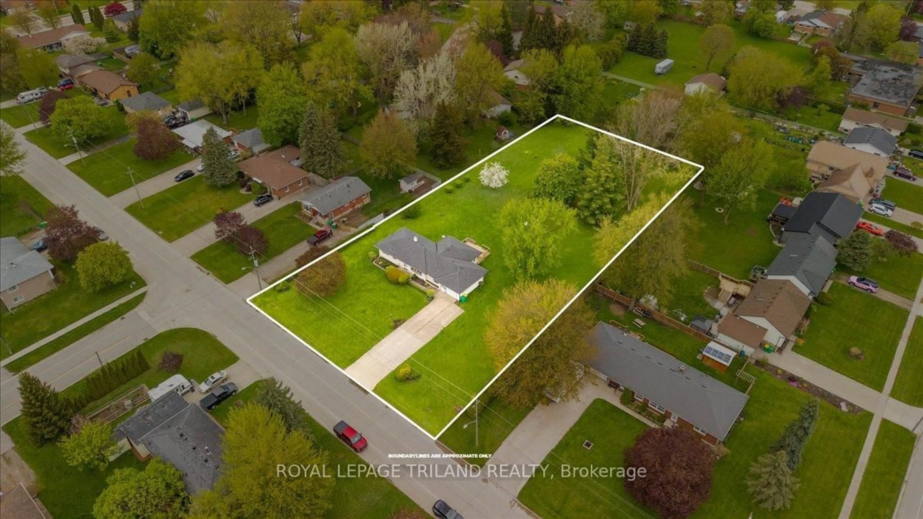 A pic from outside/outdoor area/front of a property/back of a property/a pic from drone, street for 245 Coad St, Southwest Middlesex Ontario N0L 1M0