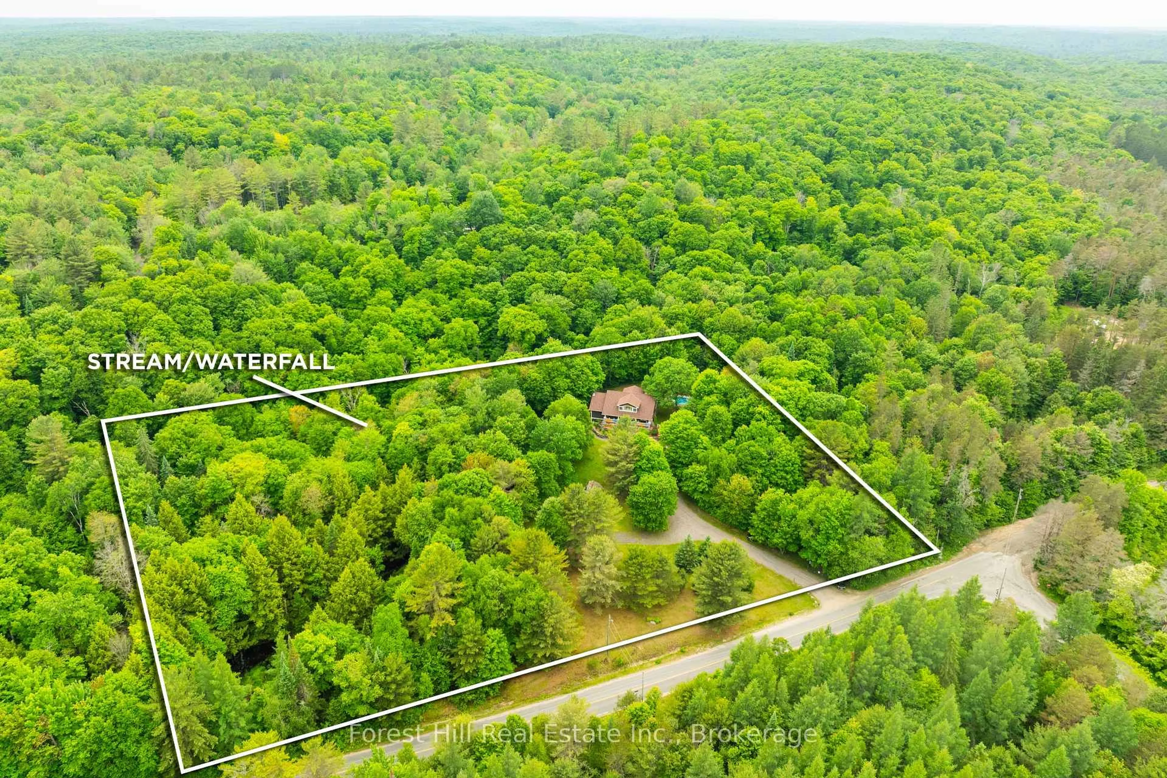 A pic from outside/outdoor area/front of a property/back of a property/a pic from drone, forest/trees view for 1474 Etwell Rd, Huntsville Ontario P1H 2J2
