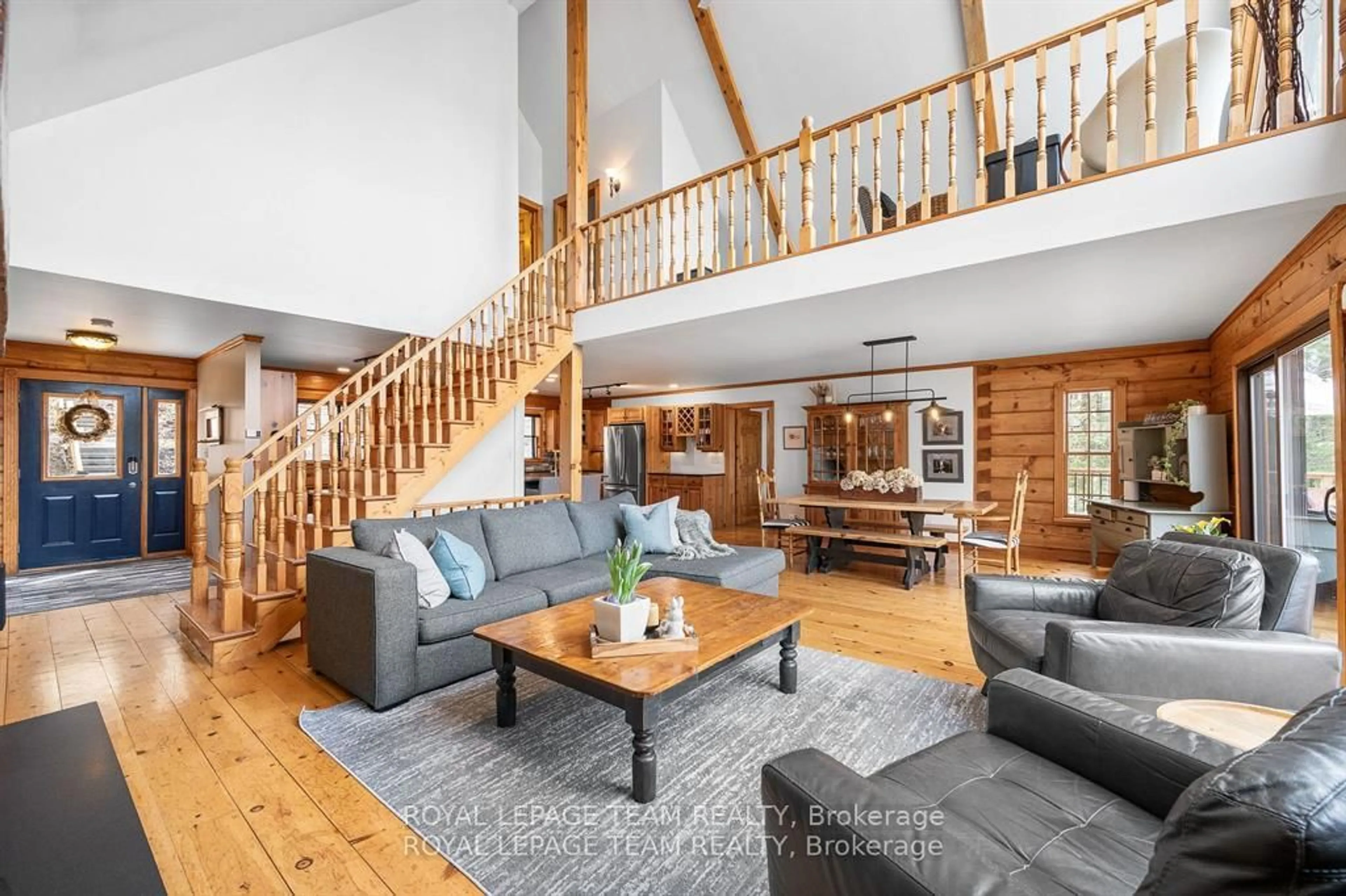 Living room with furniture, wood/laminate floor for 512 Elsie Lane, Calabogie Ontario K0J 1H0