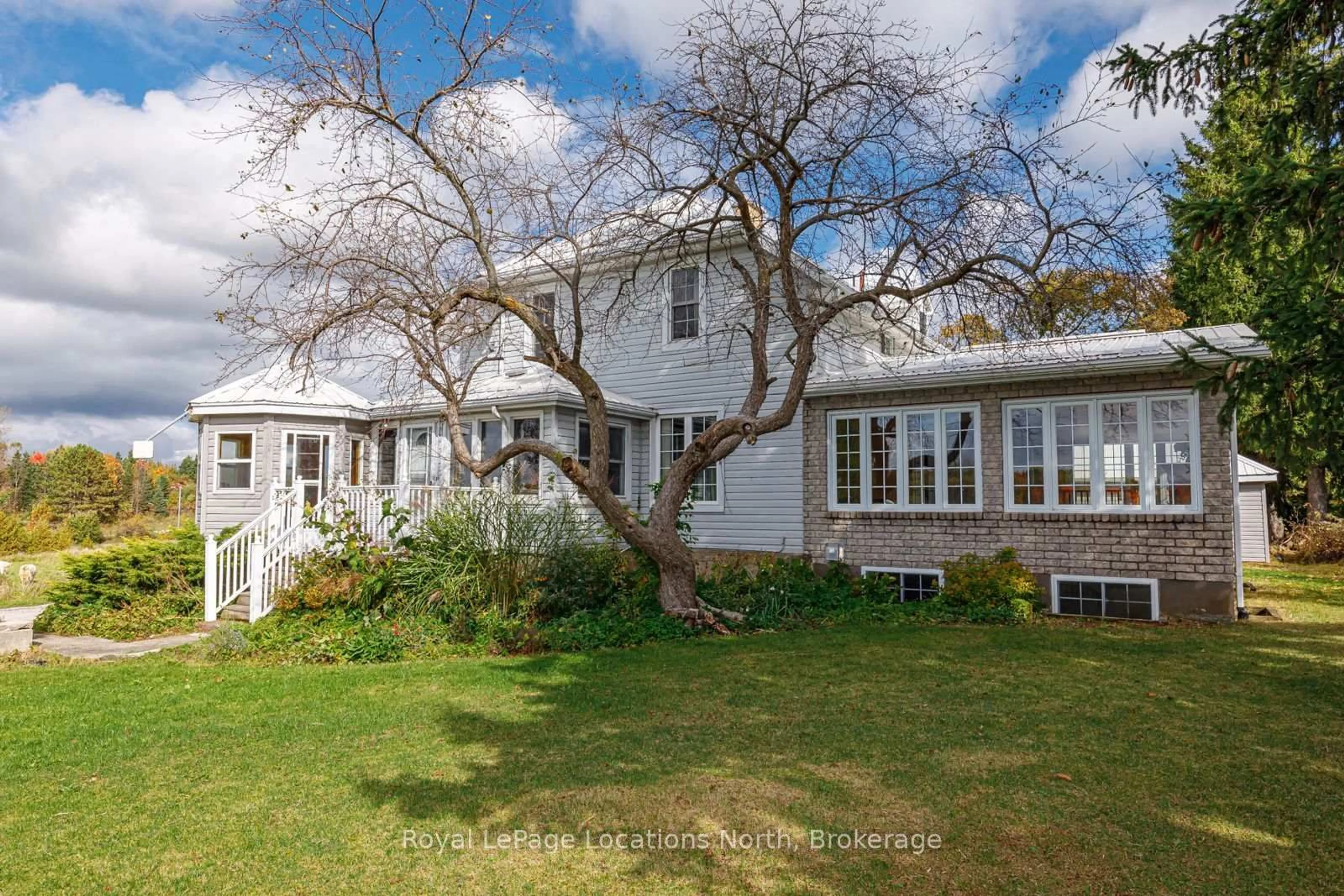 A pic from outside/outdoor area/front of a property/back of a property/a pic from drone, street for 788070 Grey Road 13, Blue Mountains Ontario N0H 1J0