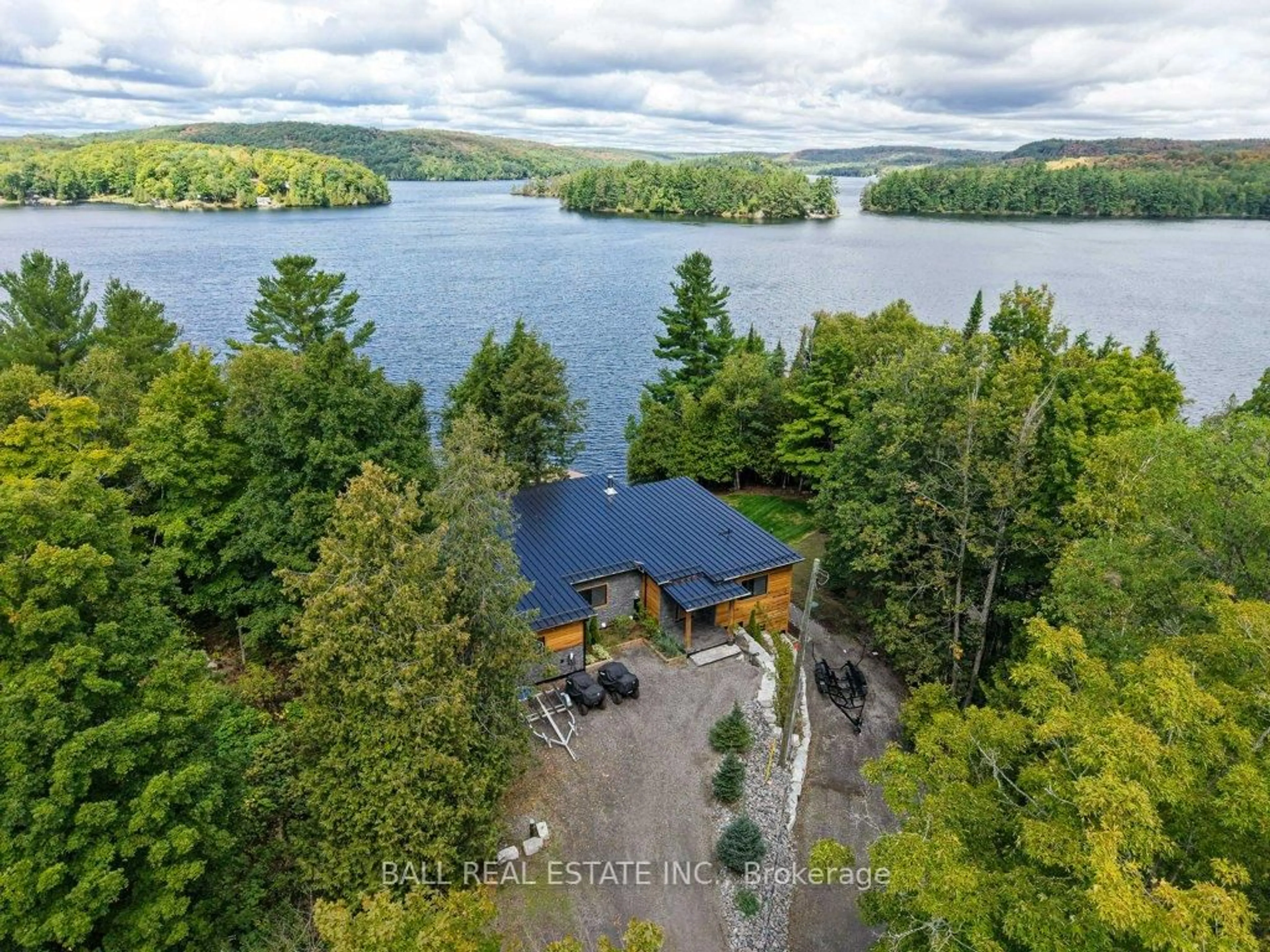 A pic from outside/outdoor area/front of a property/back of a property/a pic from drone, water/lake/river/ocean view for 1432 Abrams Rd, Highlands East Ontario K0L 1C0