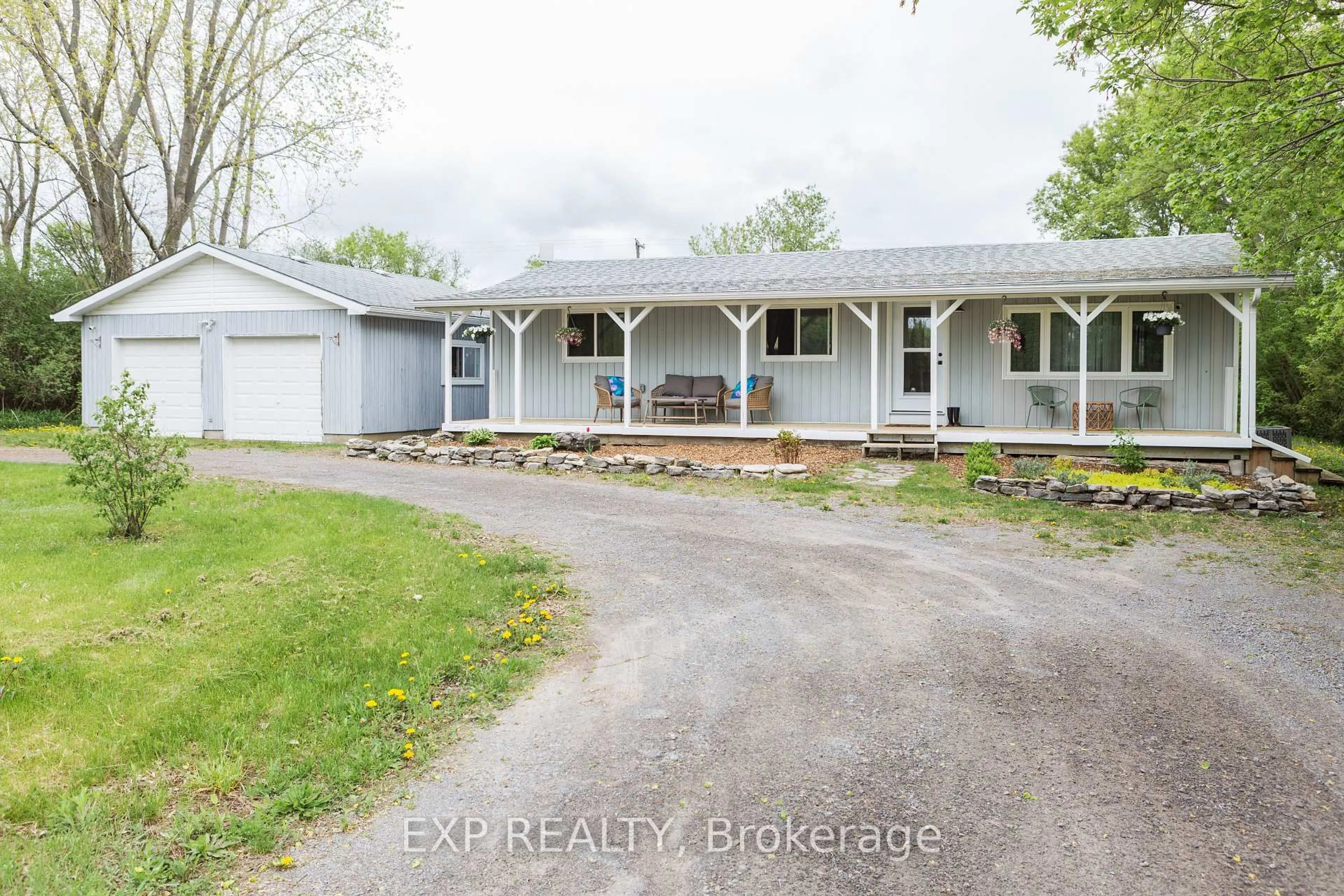 A pic from outside/outdoor area/front of a property/back of a property/a pic from drone, street for 825 County Road 8 Rd, Prince Edward County Ontario K0K 2T0
