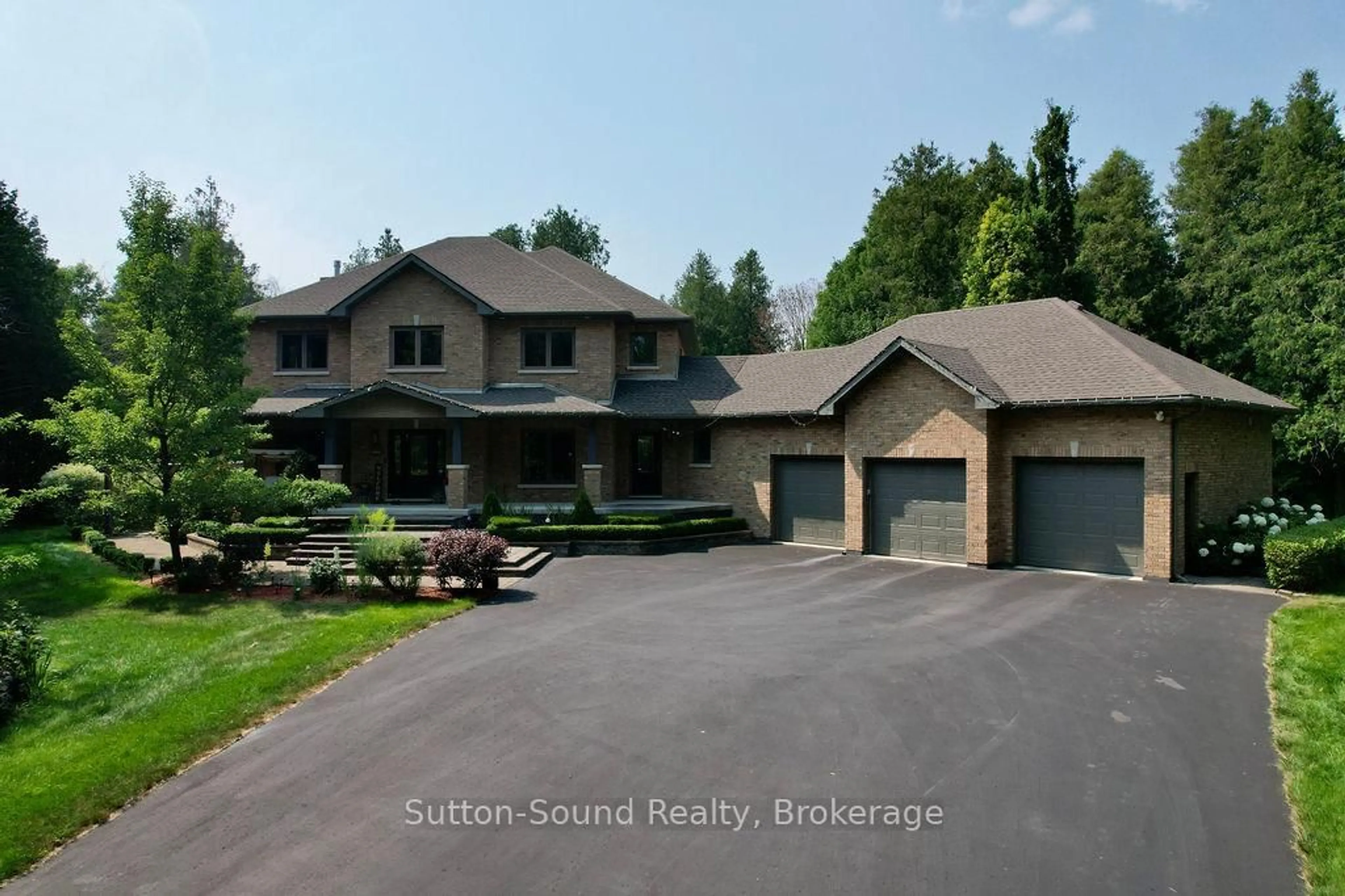 A pic from outside/outdoor area/front of a property/back of a property/a pic from drone, unknown for 318760 Grey Road 1 Rd, Georgian Bluffs Ontario N4K 5N4